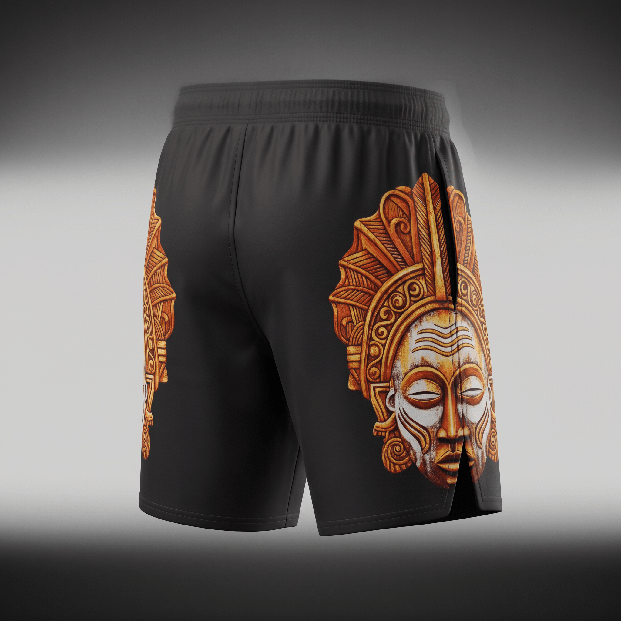 Black athletic shorts featuring a detailed gold and white tribal mask print on the sides.