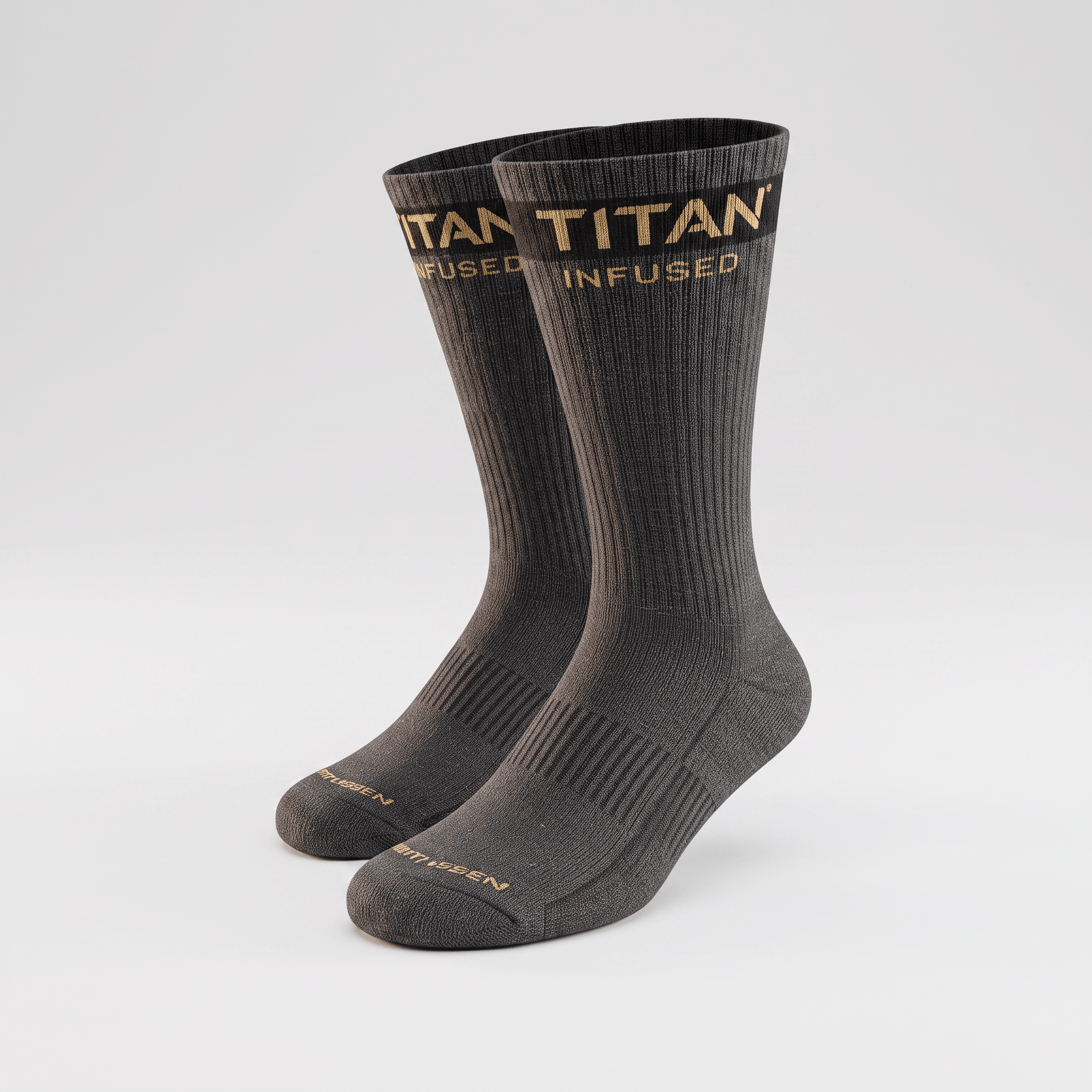 Charcoal grey Titan Infused crew socks with gold branding on the cuff and toe against a white background.