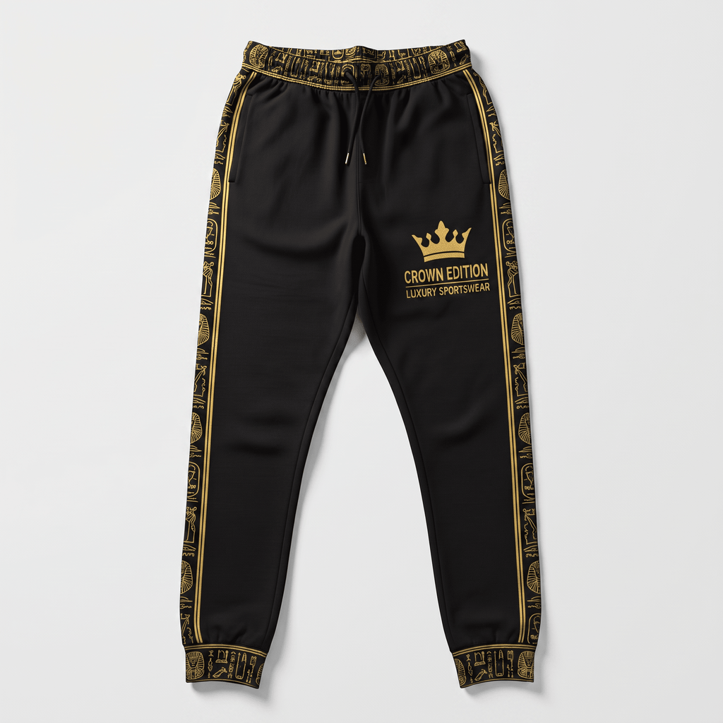 Black luxury sportswear joggers with gold hieroglyph side stripes and Crown Edition logo.