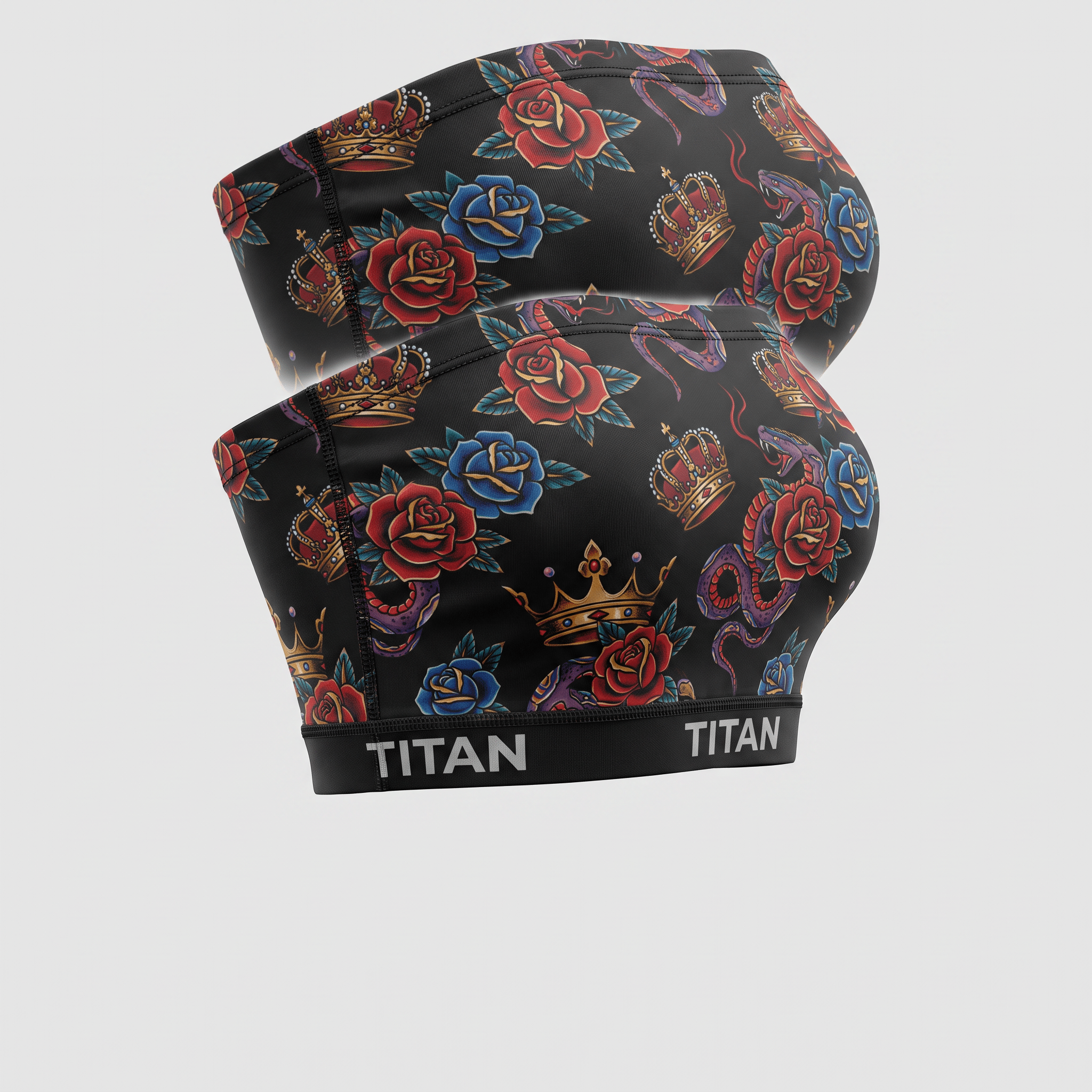 Titan black athletic shorts featuring a traditional tattoo print with red roses, blue roses, crowns, and snakes.