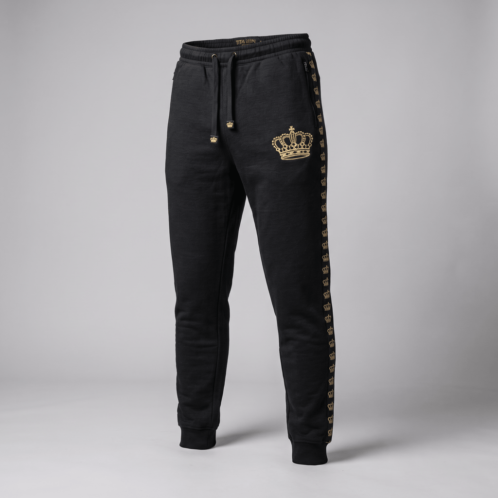 Black athletic joggers with a gold crown print on the left hip and a repeating gold crown side stripe.
