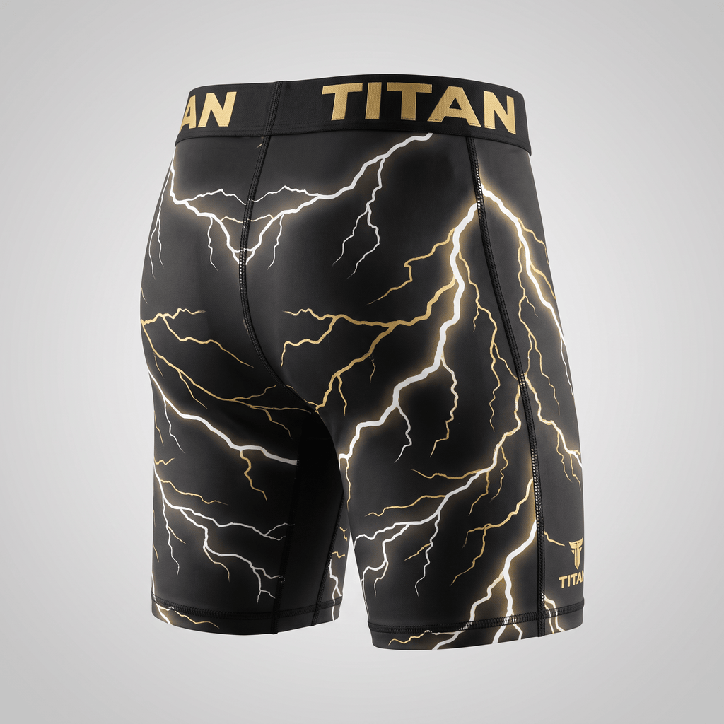 Titan black and gold lightning compression shorts shown from the back, featuring a branded waistband.