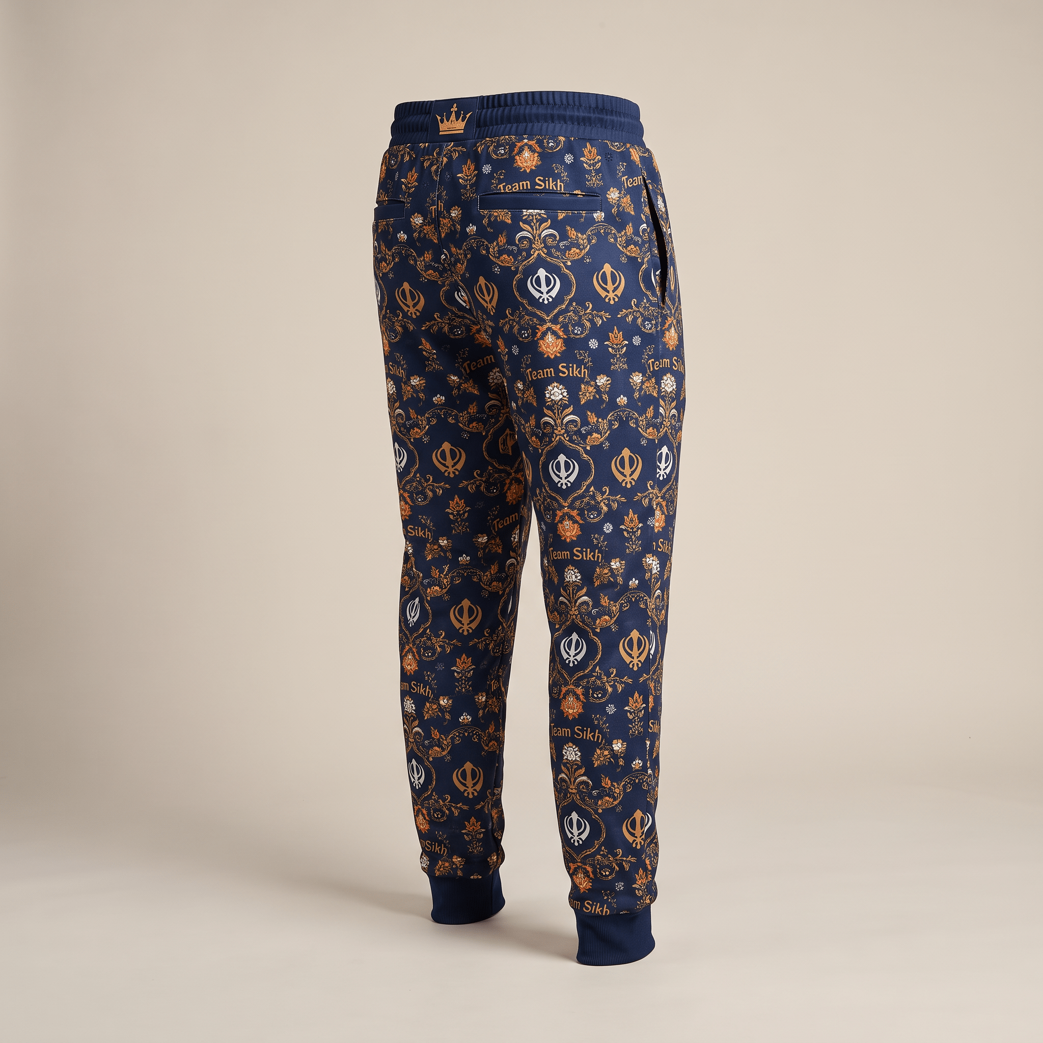 Back view of blue Team Sikh joggers featuring an intricate damask and Khanda symbol allover print.