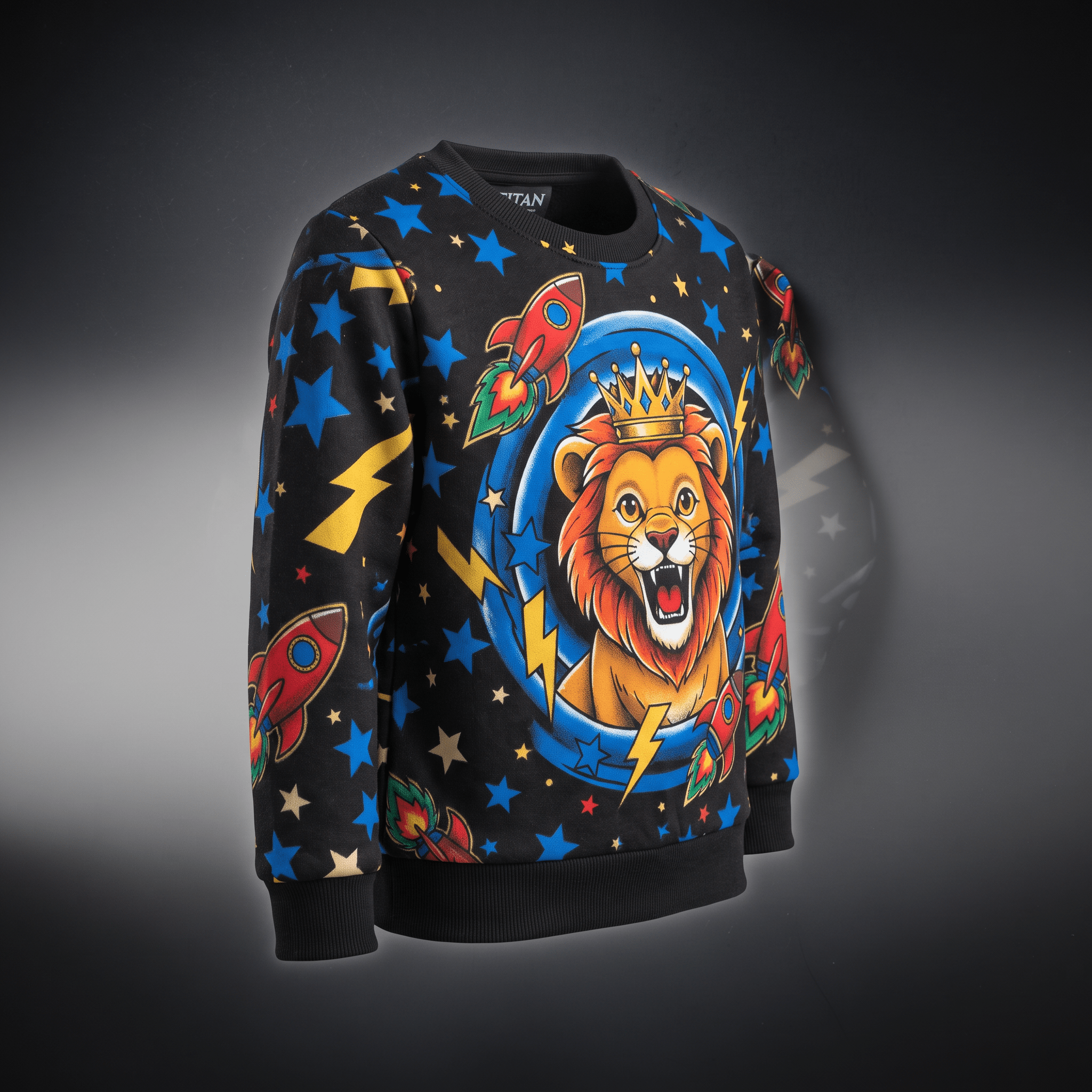 Black crewneck sweatshirt with a colorful space and lion graphic, blue stars, and rocket ships.