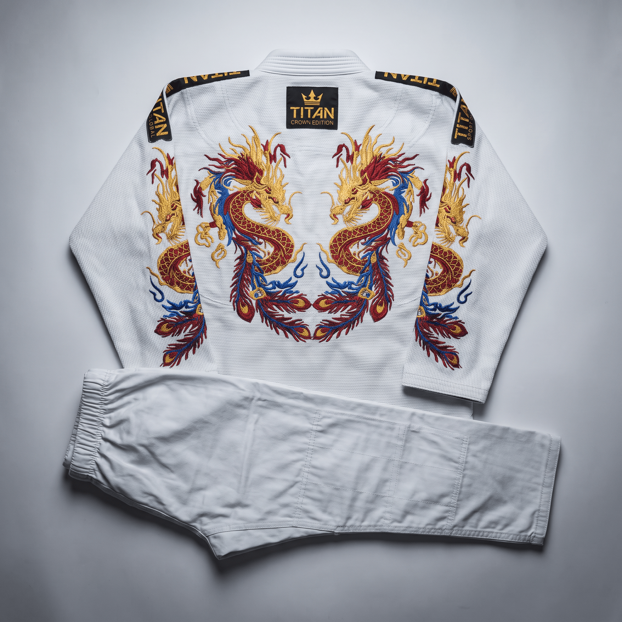 White Titan jiu-jitsu gi featuring intricate red, gold, and blue dragon embroidery on the back.