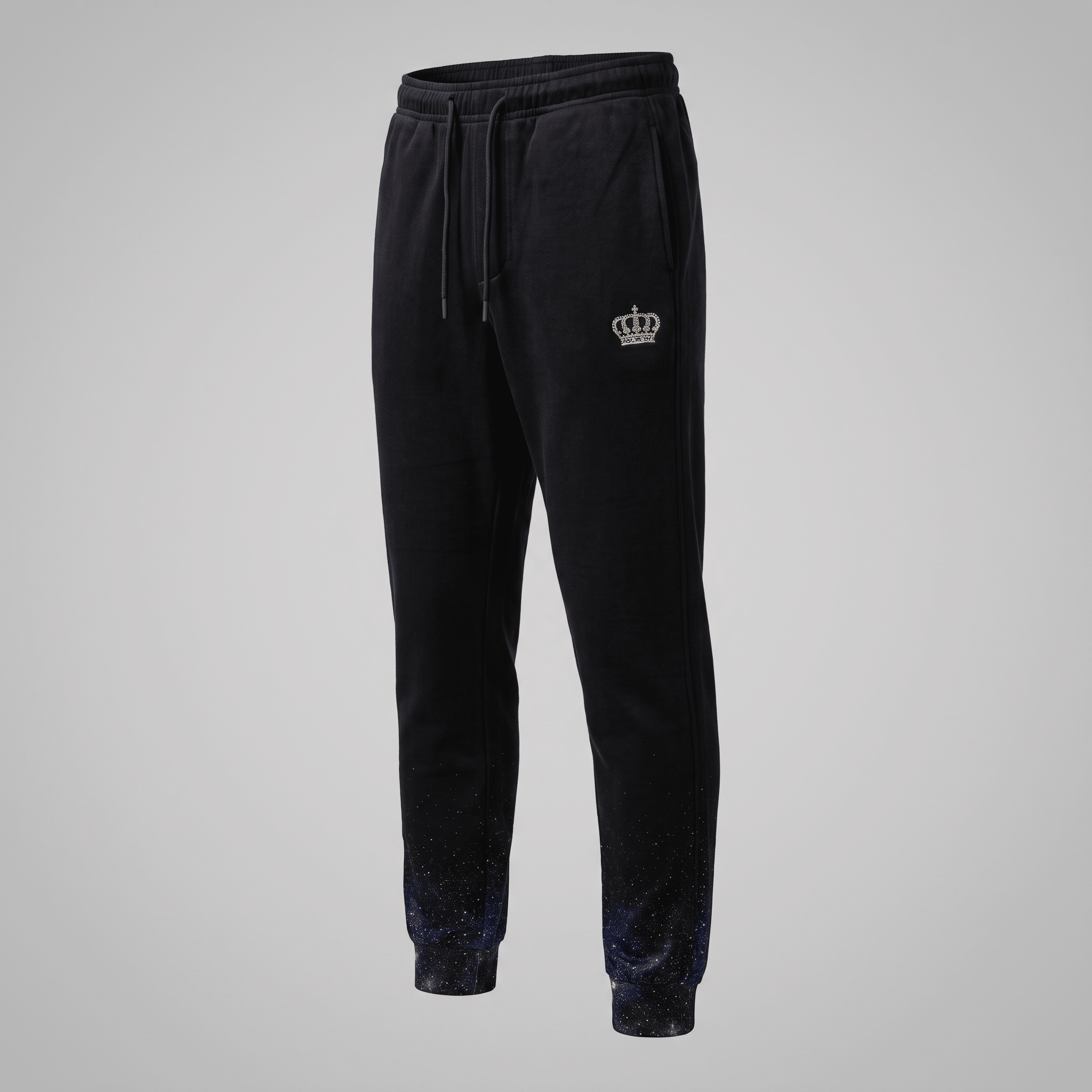 Black joggers with a drawstring waist, white crown logo, and blue galaxy gradient print on the cuffs.