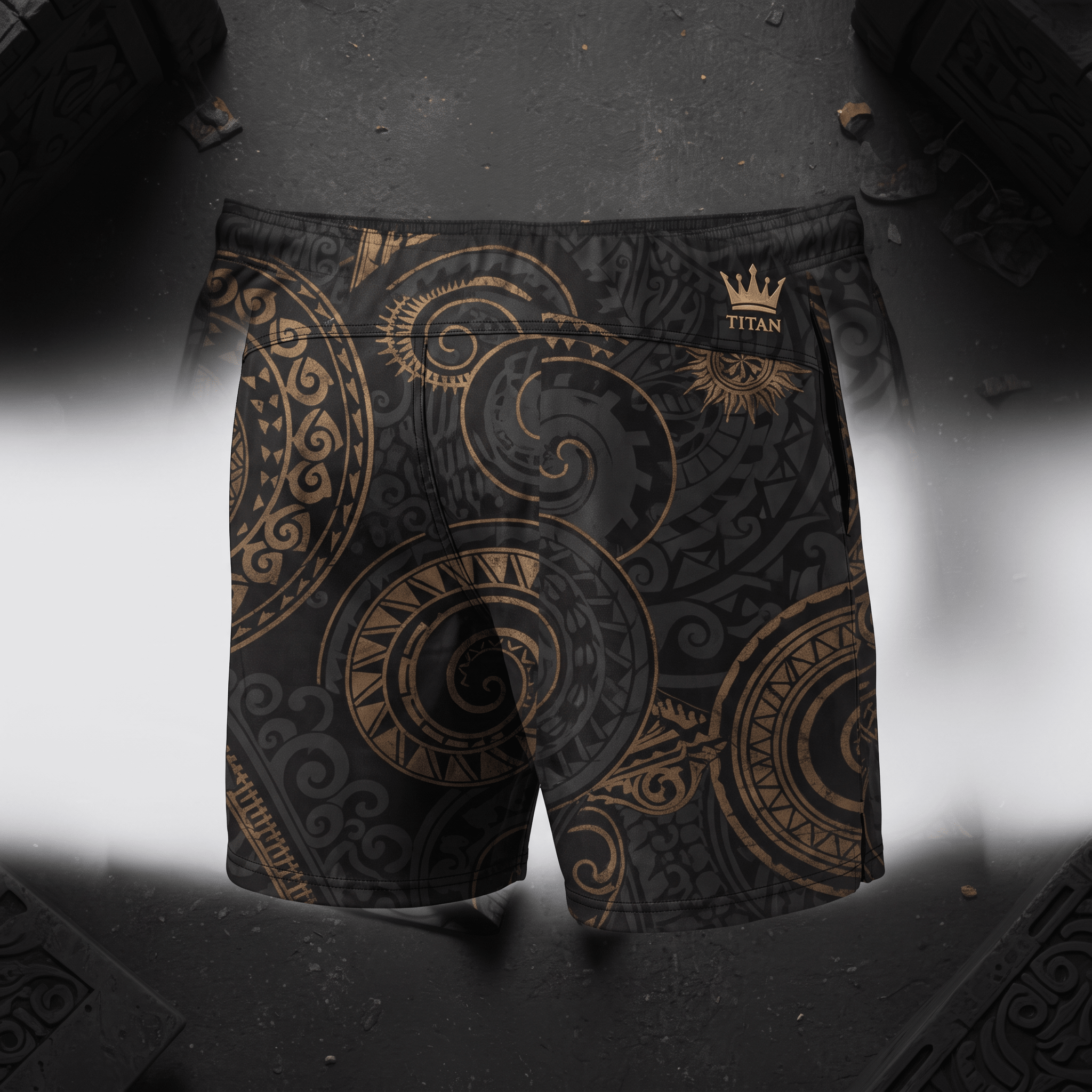 Black athletic shorts with gold tribal Polynesian tattoo patterns and a crown logo on a dark background.