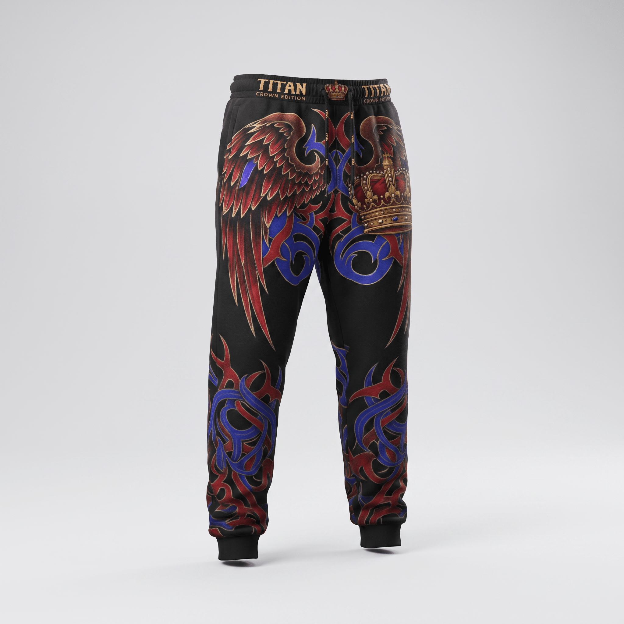 Black Titan Crown Edition sweatpants with red and blue tribal graphics, wings, and a crown on the leg.