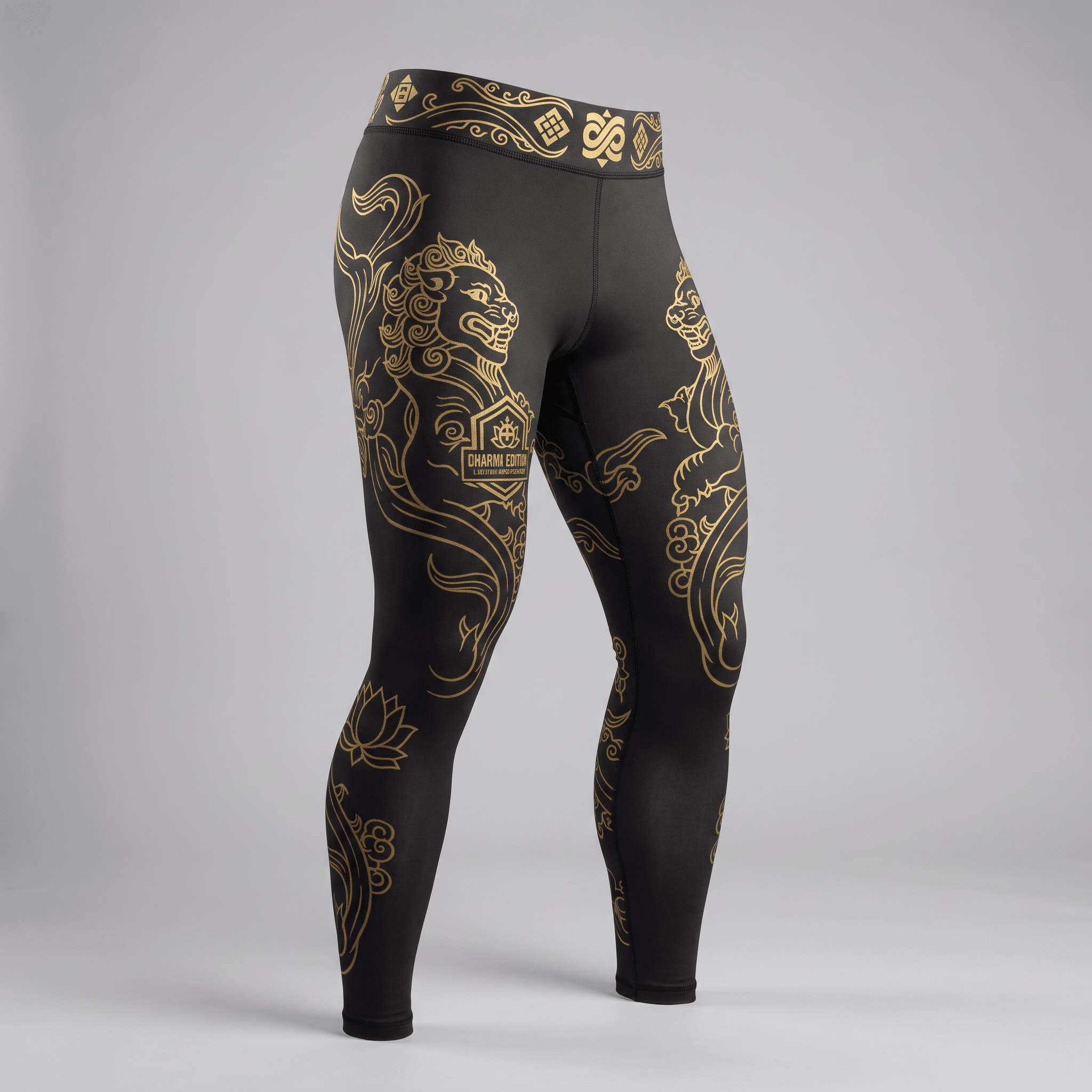 Black athletic leggings with gold lion and lotus graphic prints and patterned waistband.