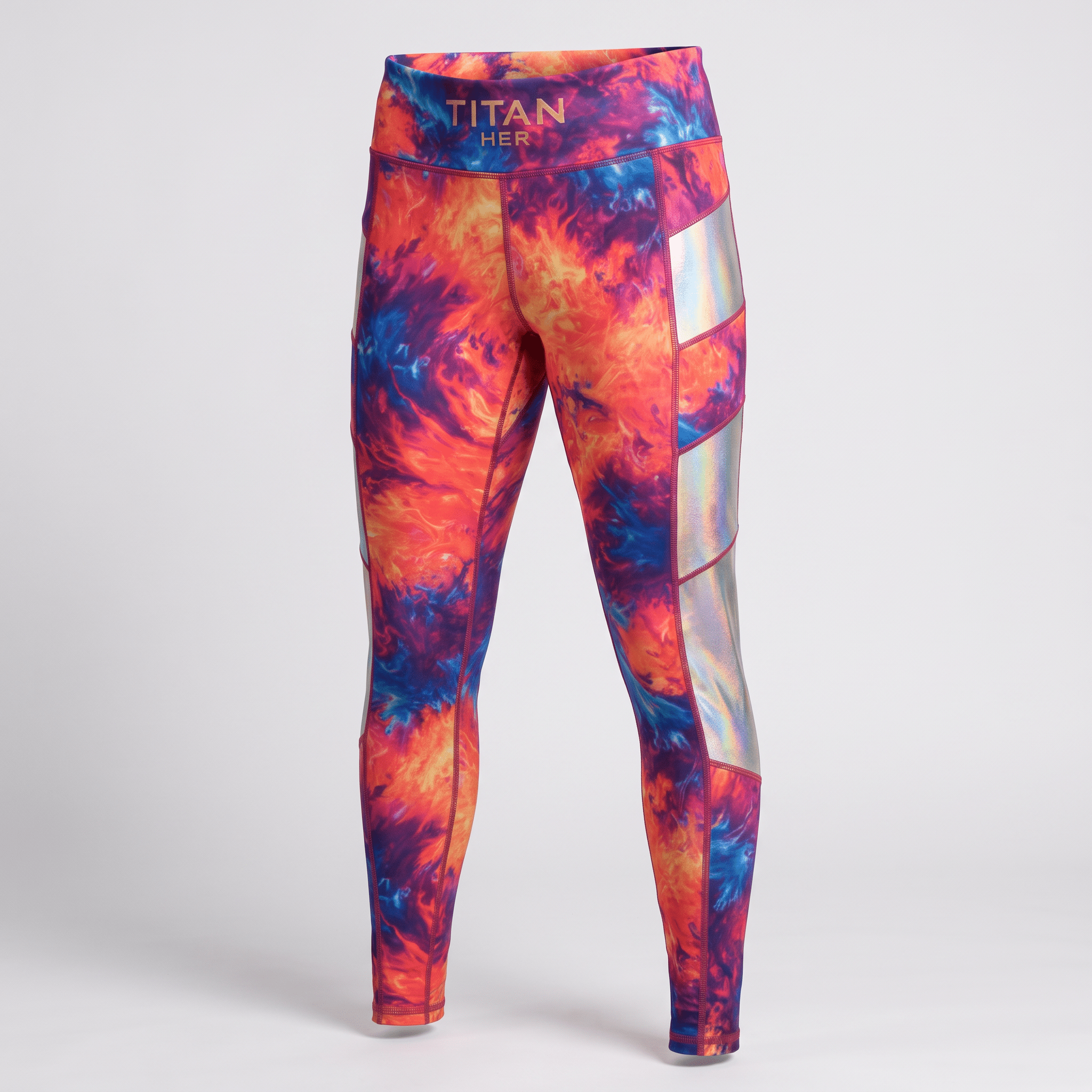 Titan Her athletic leggings featuring a vibrant orange and blue tie-dye pattern with reflective side panels.