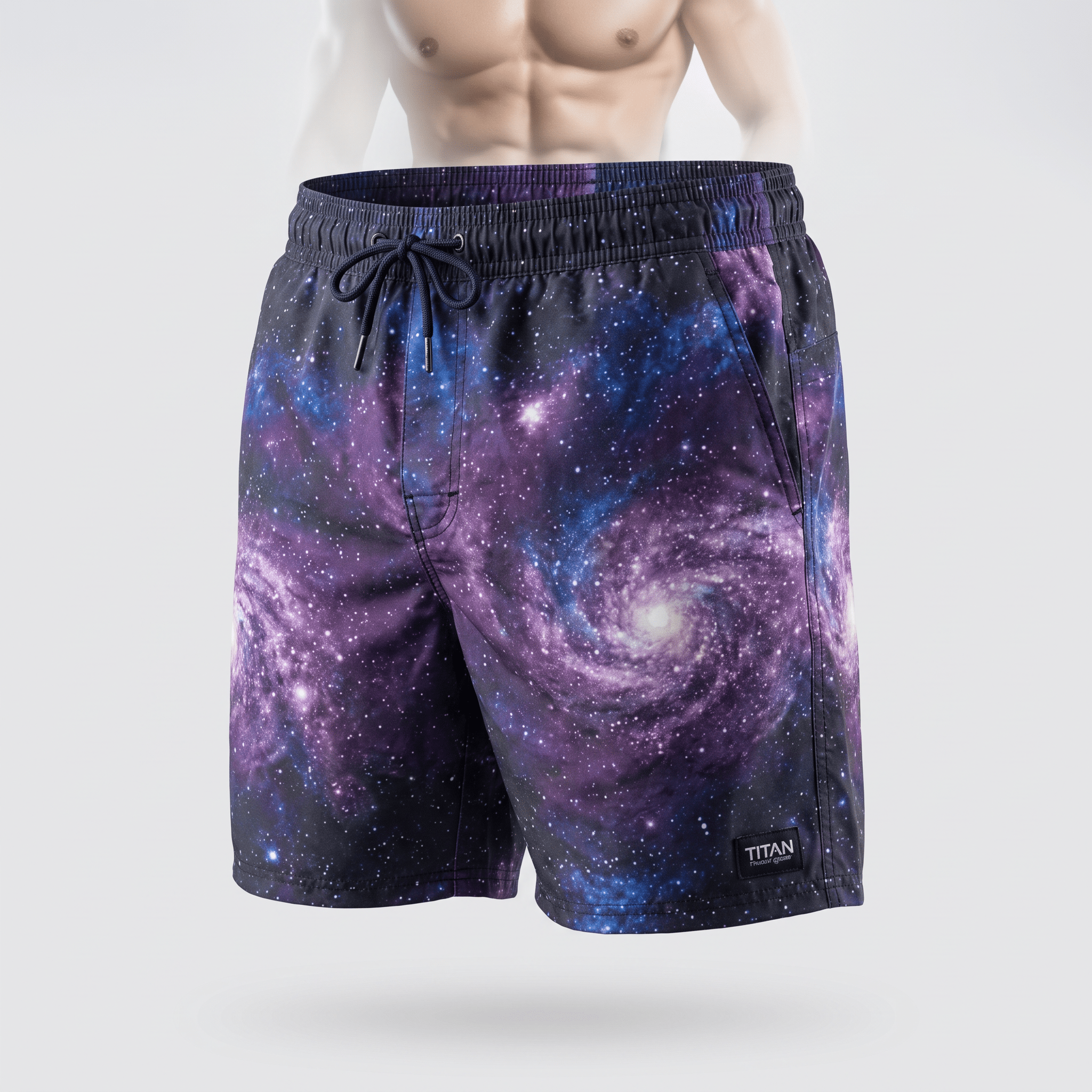 Purple and blue galaxy print swim trunks with an elastic drawstring waist displayed on a male mannequin.
