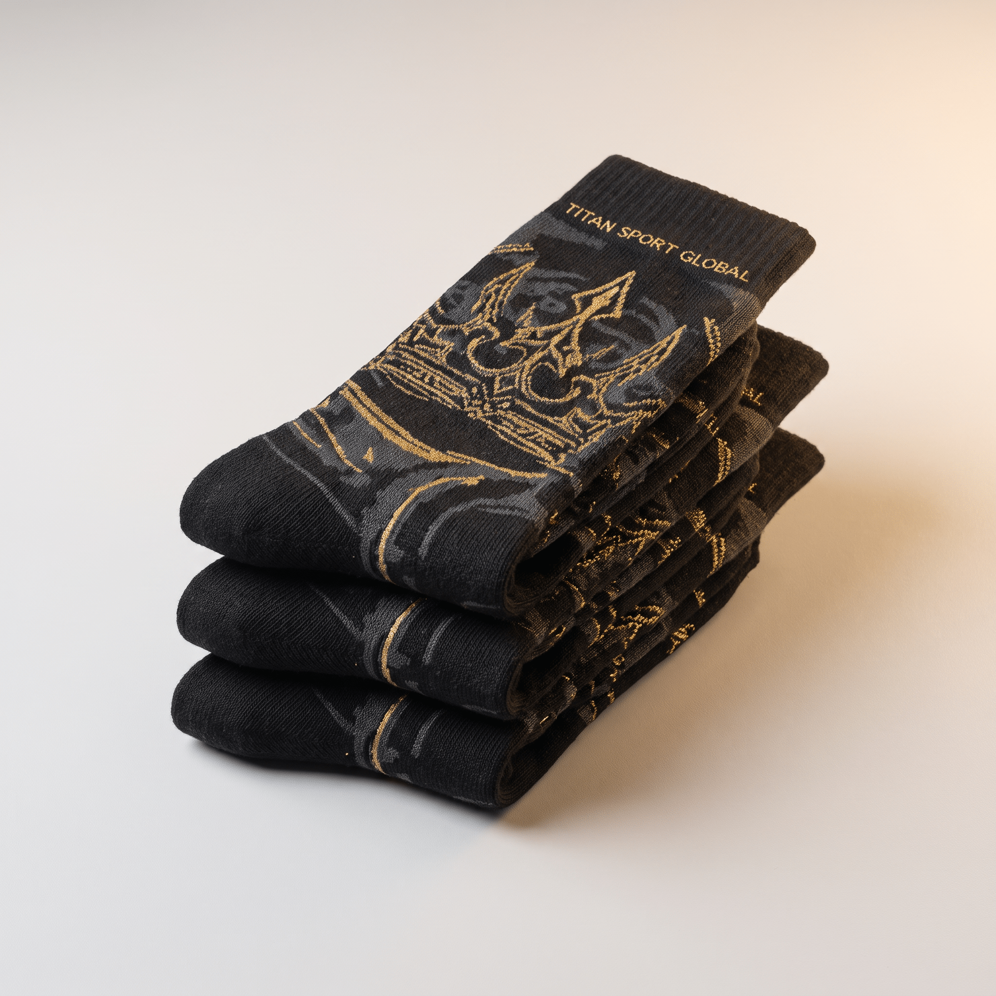 Folded black crew socks with gold crown graphic and Titan Sport Global text on a neutral background.