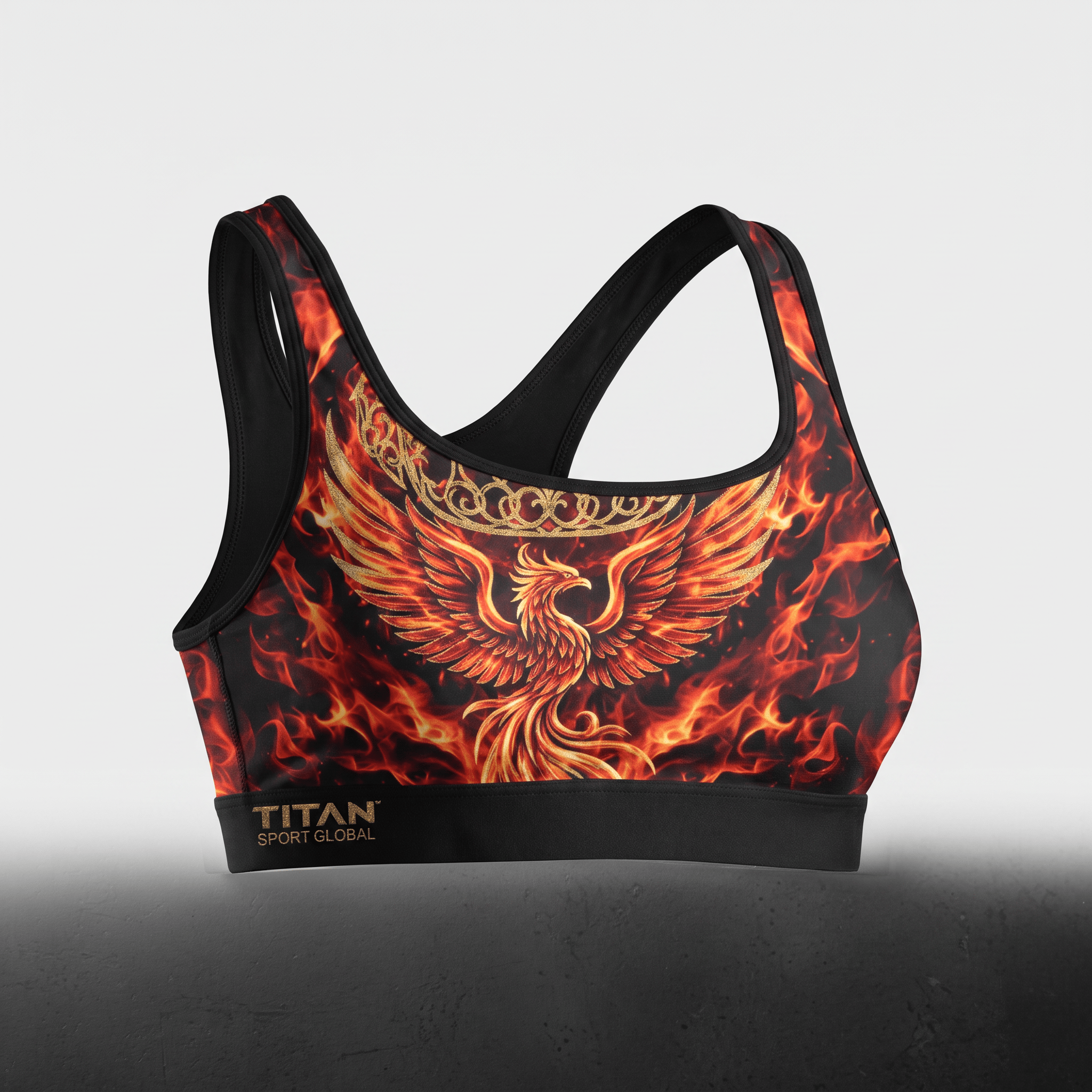 Black sports bra with a red and orange fire and phoenix graphic, featuring a black band with gold Titan branding.