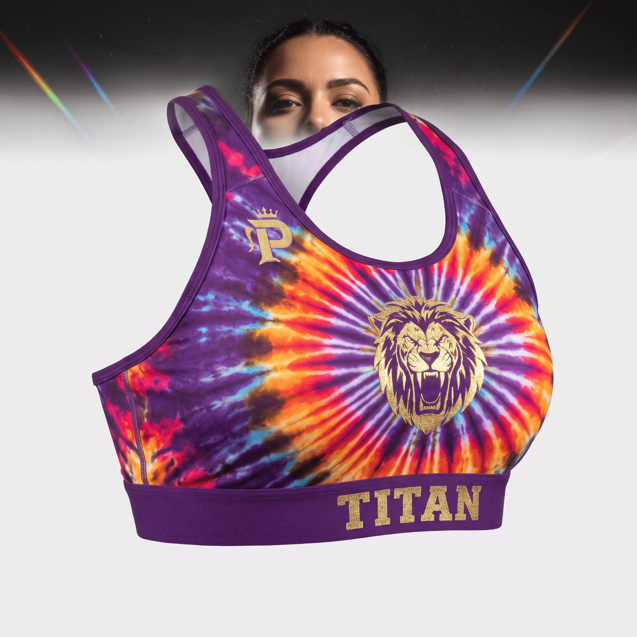 Purple and orange tie-dye sports bra with a gold lion logo and Titan text on the band worn by a model.