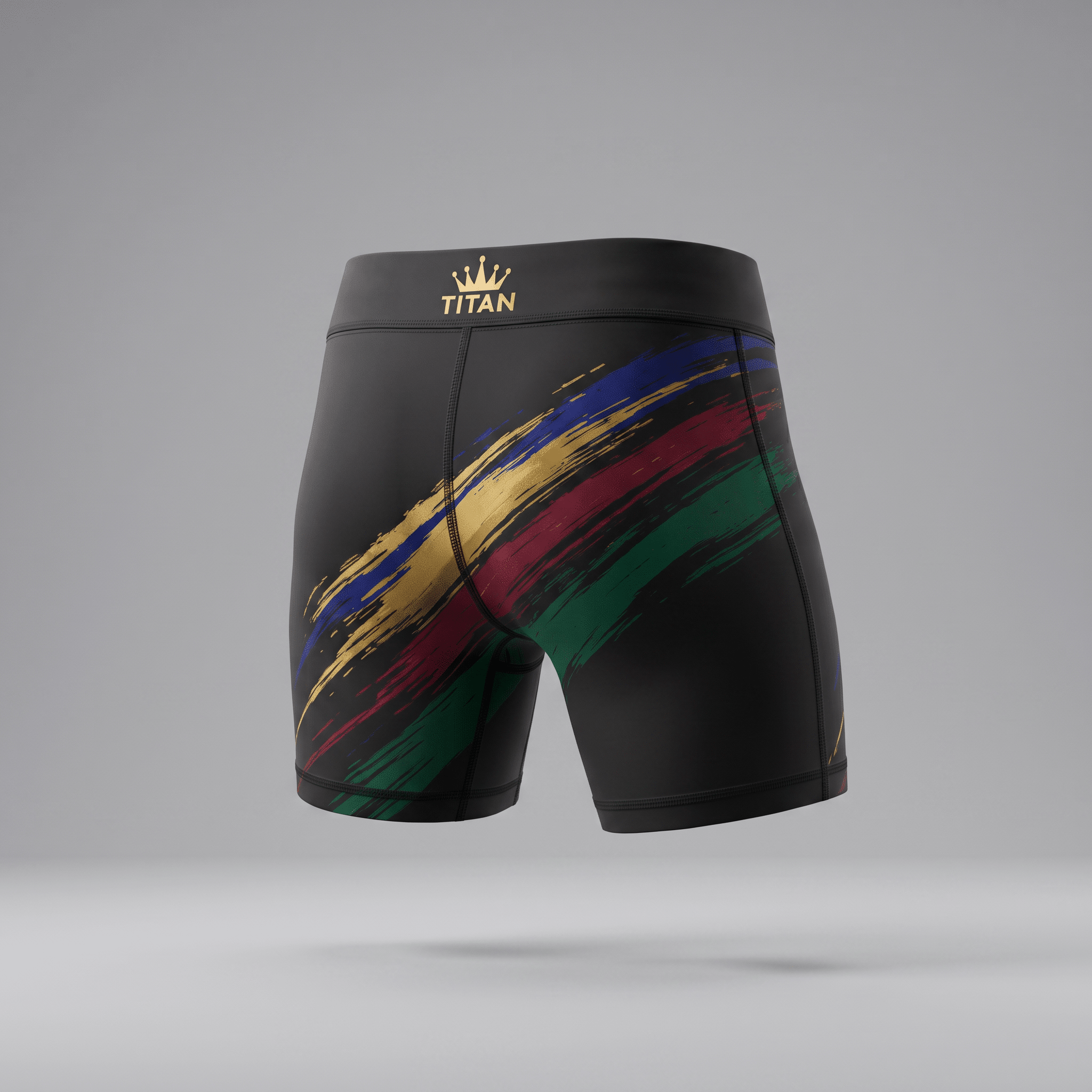 Rear view of black athletic compression shorts featuring diagonal gold, blue, red, and green brushstrokes and a gold Titan logo.