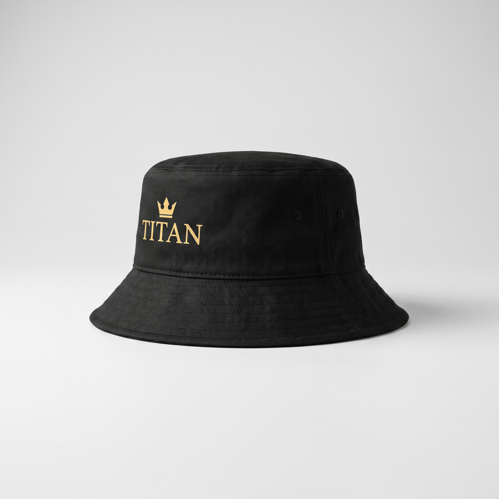 Black bucket hat with gold Titan text and crown logo embroidery on a light background.