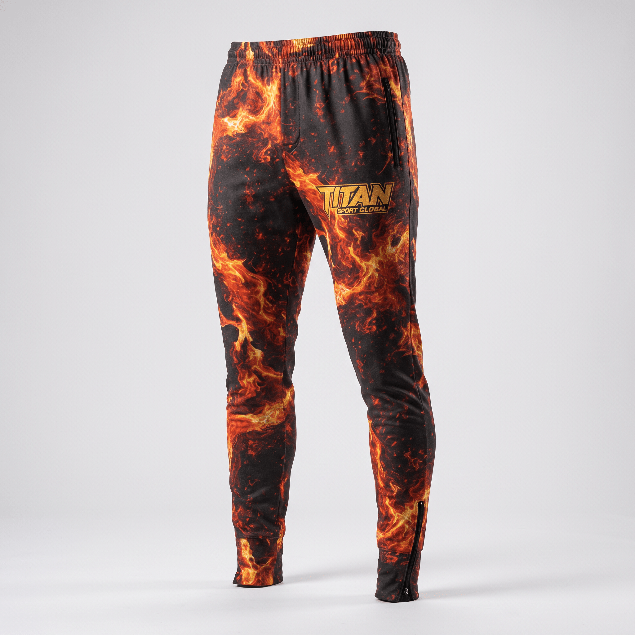 Black athletic sweatpants with vibrant red and orange flame print, zipper pockets, and Titan Sport Global logo.
