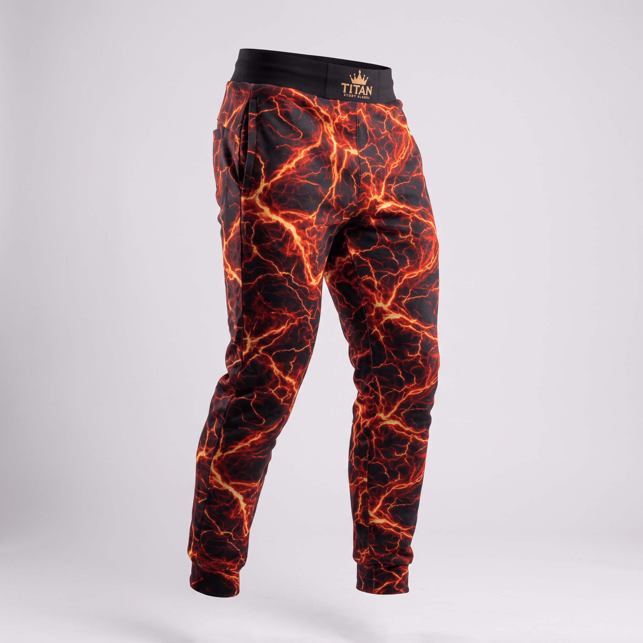 Black sweatpants featuring an orange and red lightning bolt print, with a black waistband and gold logo.