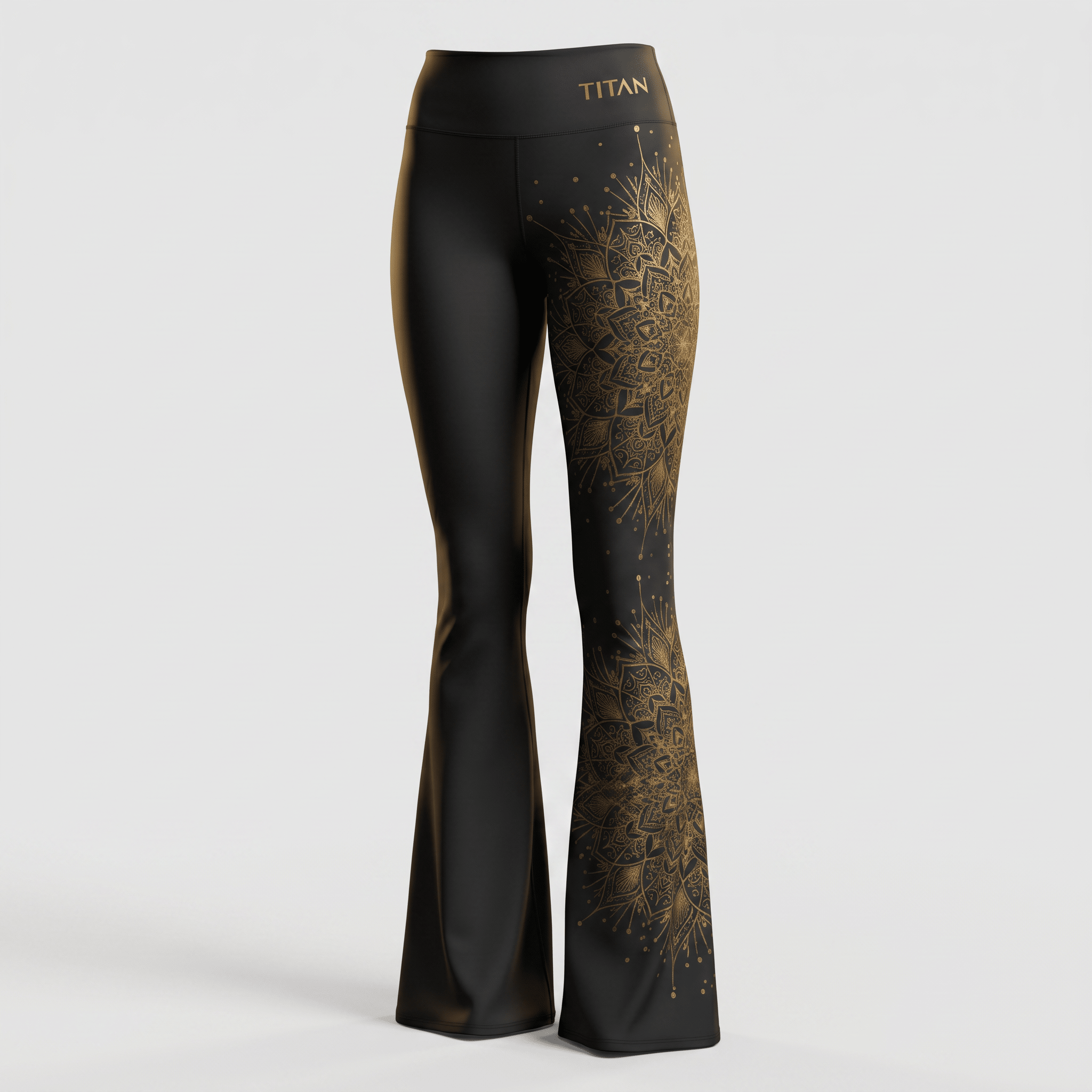 Black flare yoga pants with metallic gold mandala print on the left leg and Titan logo on the waistband.