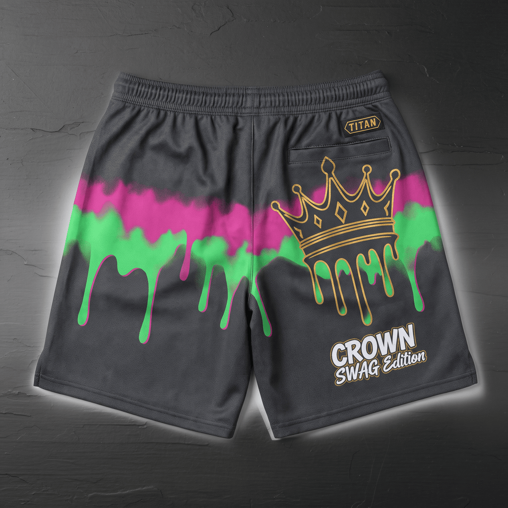 Back of dark grey athletic shorts with pink and green paint drip graphics, gold crown, and text.