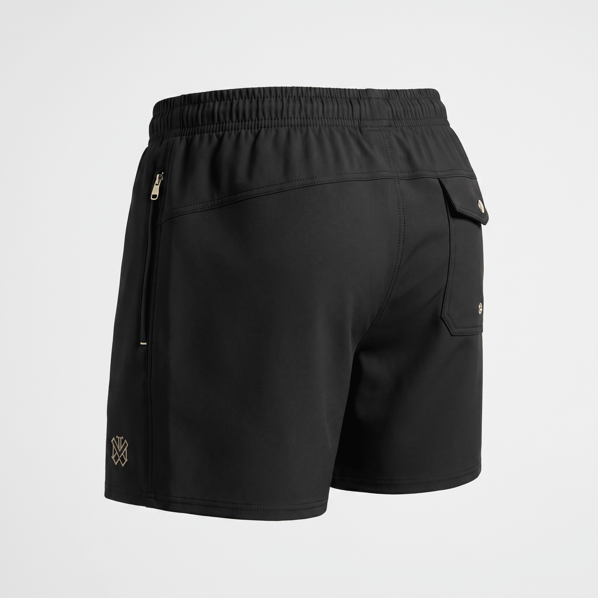 Black athletic shorts with an elastic waistband, back pocket, and side zipper pocket viewed from behind.
