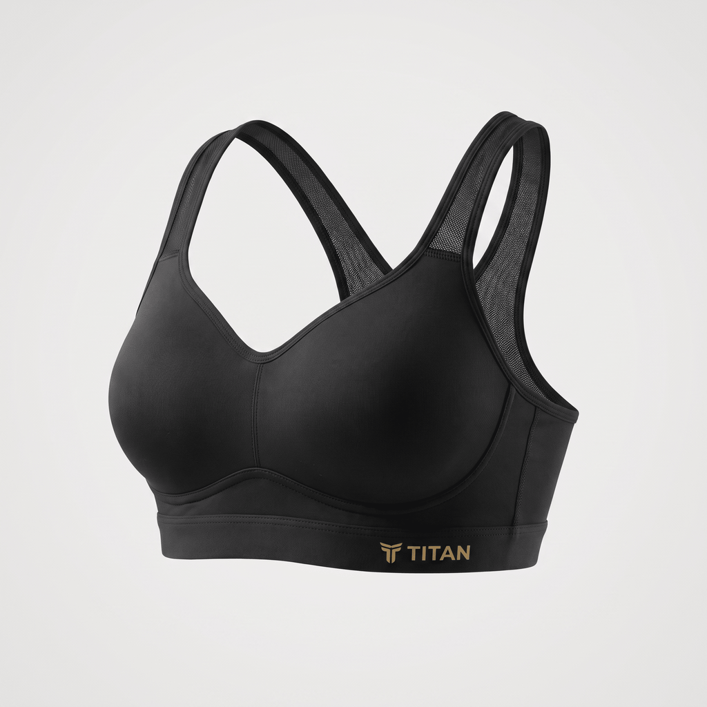 Black Titan sports bra with molded cups and mesh racerback straps on a light gray background.