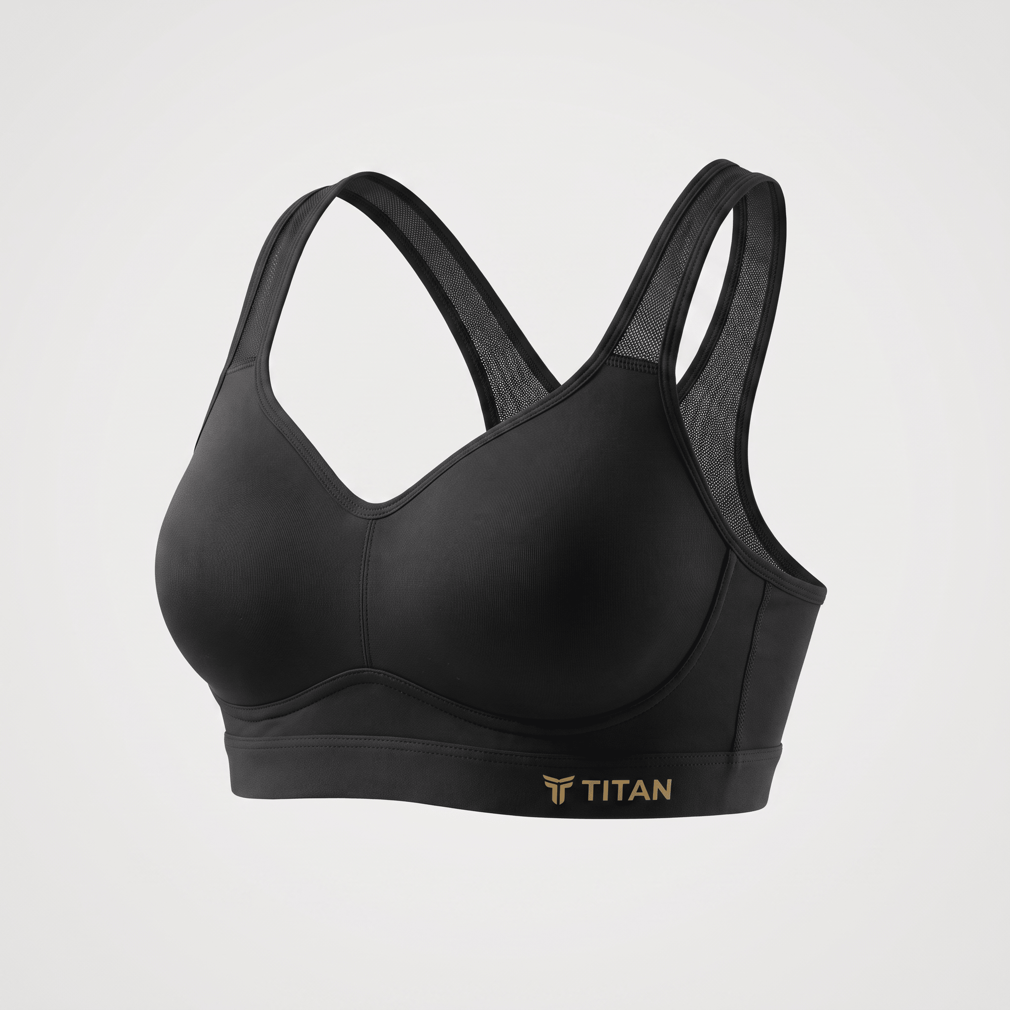 Black Titan sports bra with molded cups and mesh racerback straps on a light gray background.