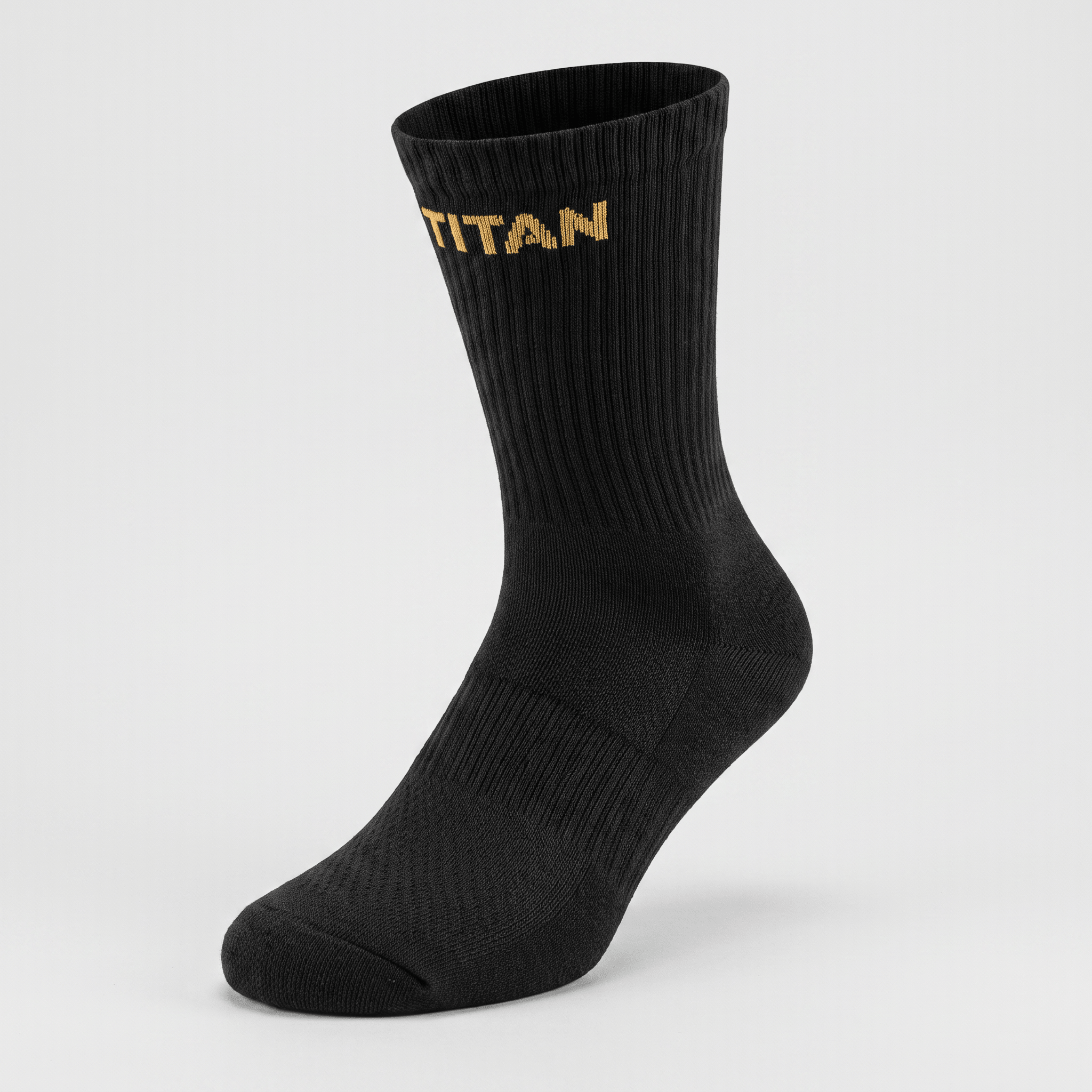 Black crew sock featuring the word TITAN knit in gold near the ribbed top against a light gray background.