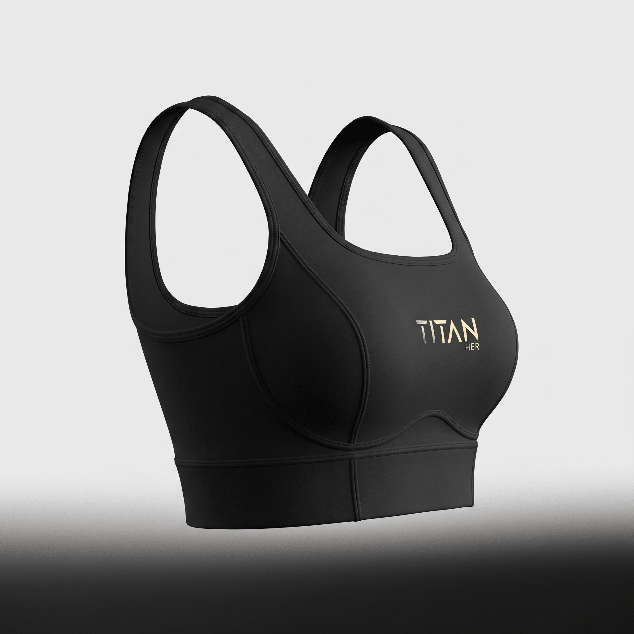Black sports bra with wide straps and gold Titan Her logo on the front against a neutral background.