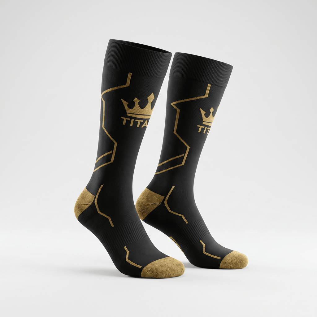 Black crew socks with gold athletic line patterns, crown logo, and TITA text on a white background.