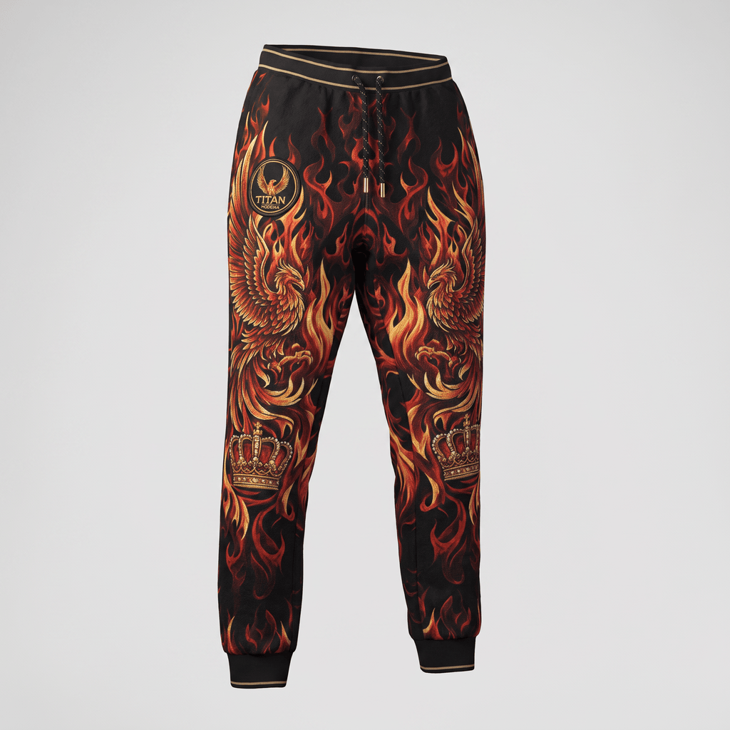 Black sweatpants with vibrant red and orange flame, phoenix, and crown graphics against a neutral backdrop.