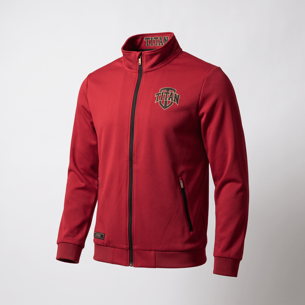 Red Titan zip-up track jacket with black zipper, stand-up collar, and crest logo on chest.