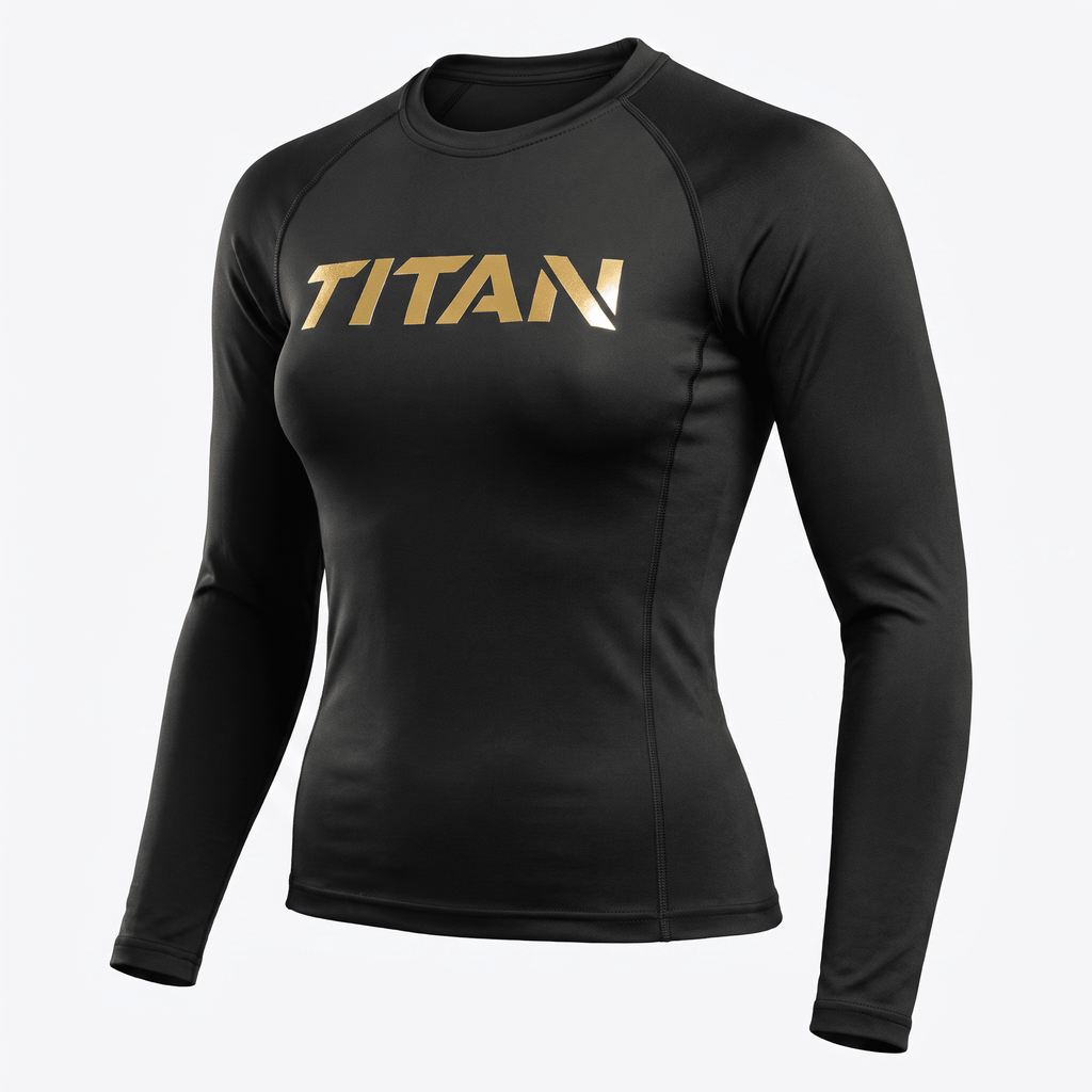 Black long-sleeve women's rash guard with gold Titan logo on chest and raglan sleeves.