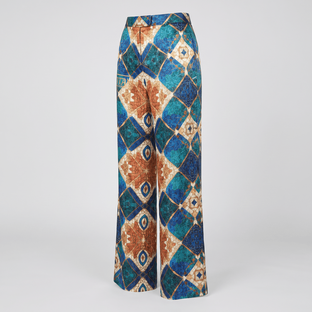 Wide-leg trousers featuring a geometric diamond mosaic print in blue, teal, and tan tones.