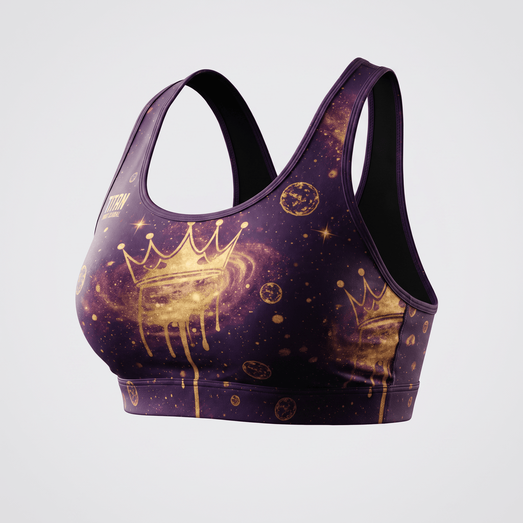 Purple sports bra with gold galaxy print, planets, and a dripping crown graphic on the front.