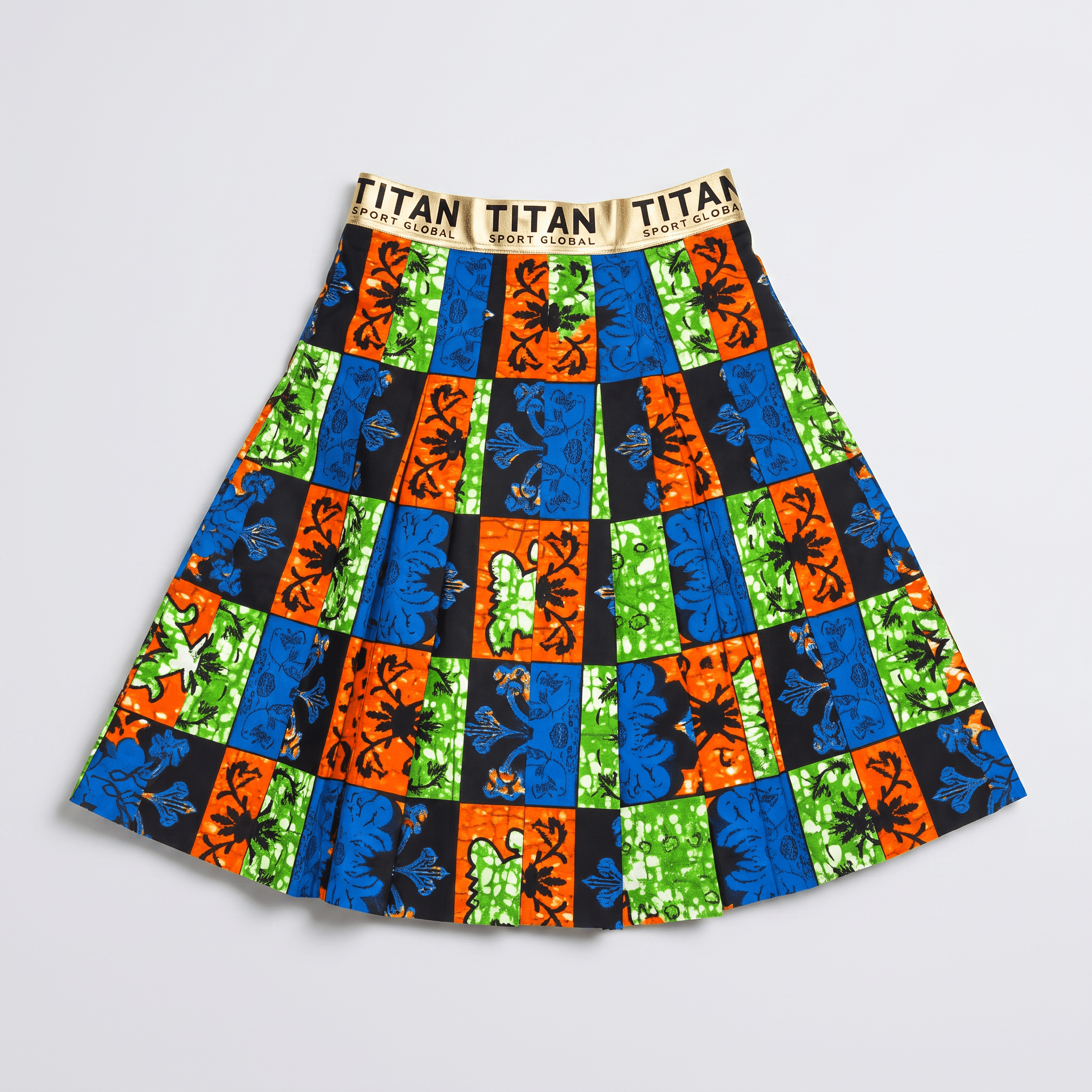 Pleated knee-length skirt featuring vibrant colorful African print patterns and a metallic gold branded waistband.