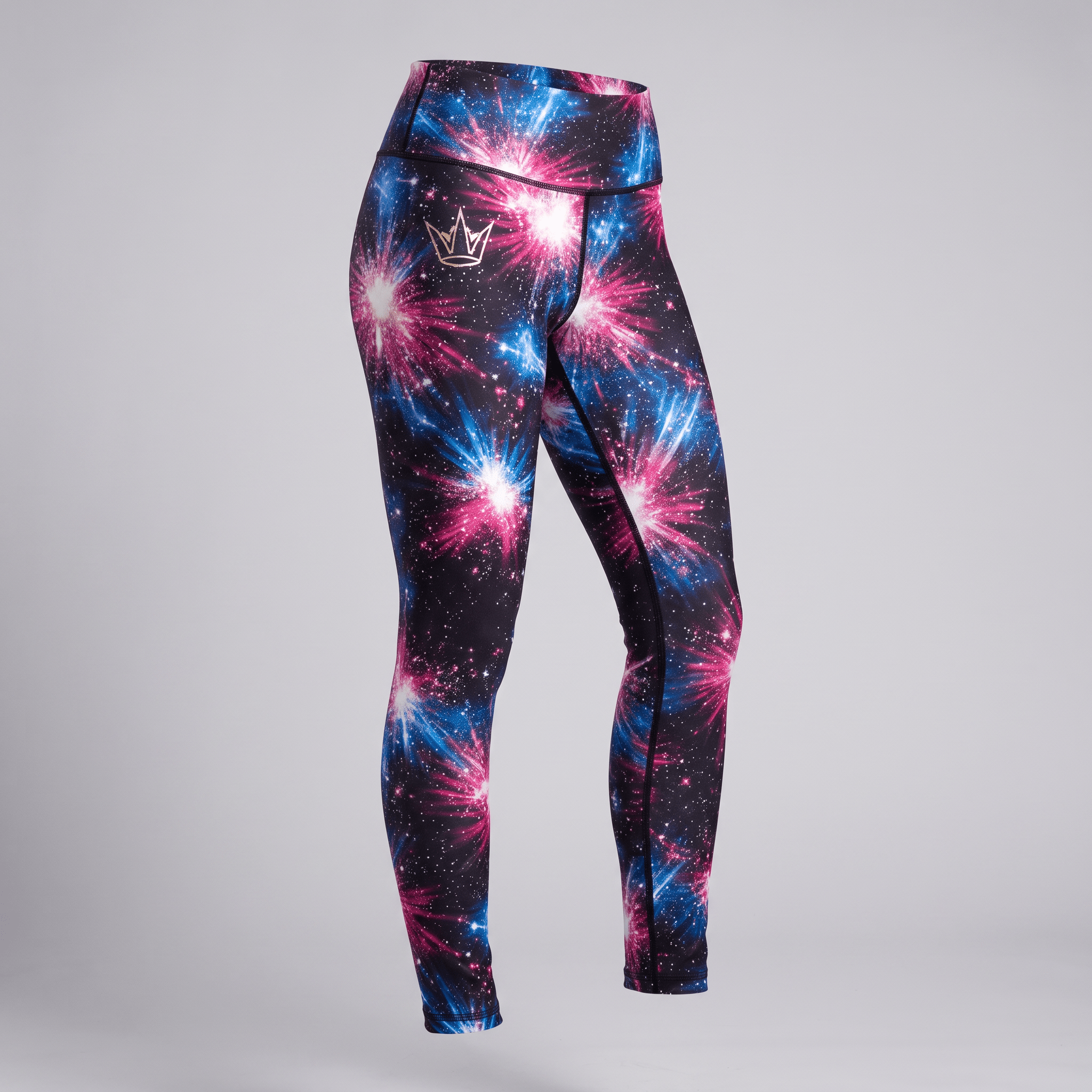 High-waisted athletic leggings in black with vibrant pink and blue starburst nebula print and silver crown logo.