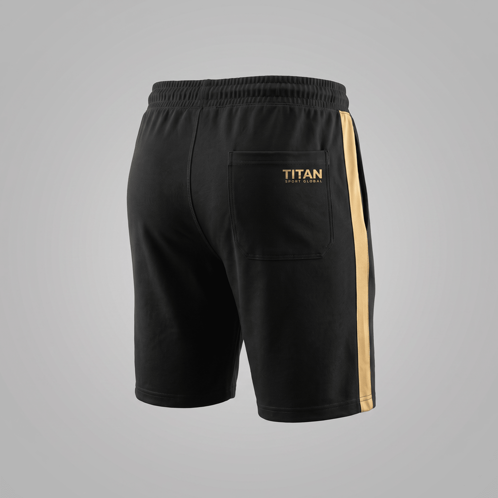 Back view of black athletic shorts with gold side stripes, a back pocket, and Titan Sport Global logo.