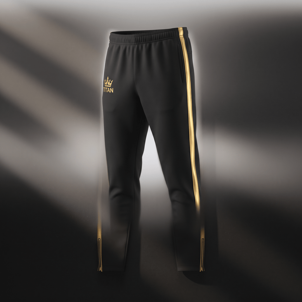 Black athletic sweatpants with gold side stripes, Titan crown logo on the right hip, and zippered cuffs.