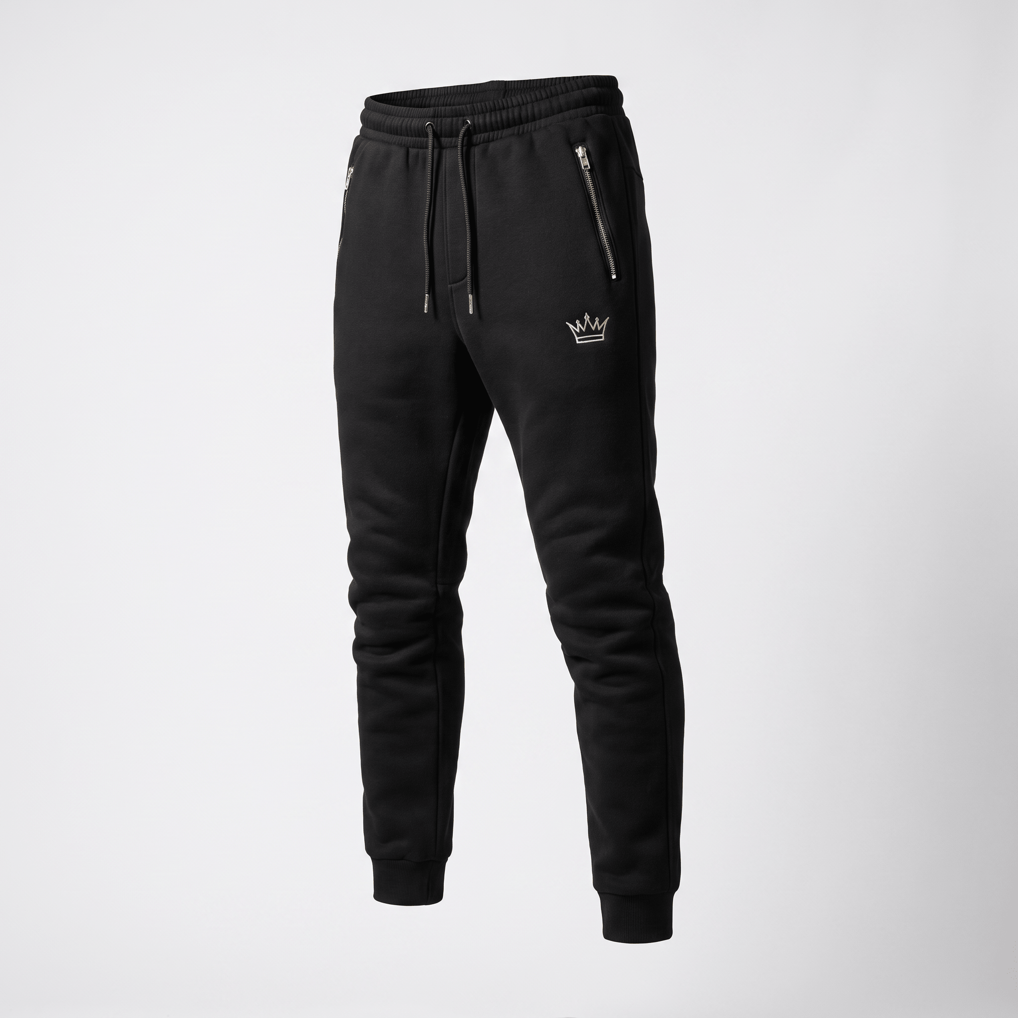 Black athletic joggers with zippered pockets, drawstring waistband, and a white crown logo.