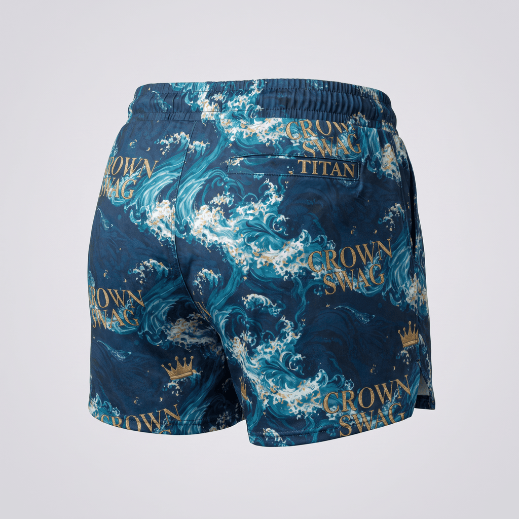 Back view of blue swim trunks featuring gold Japanese wave and crown print with text detailing.