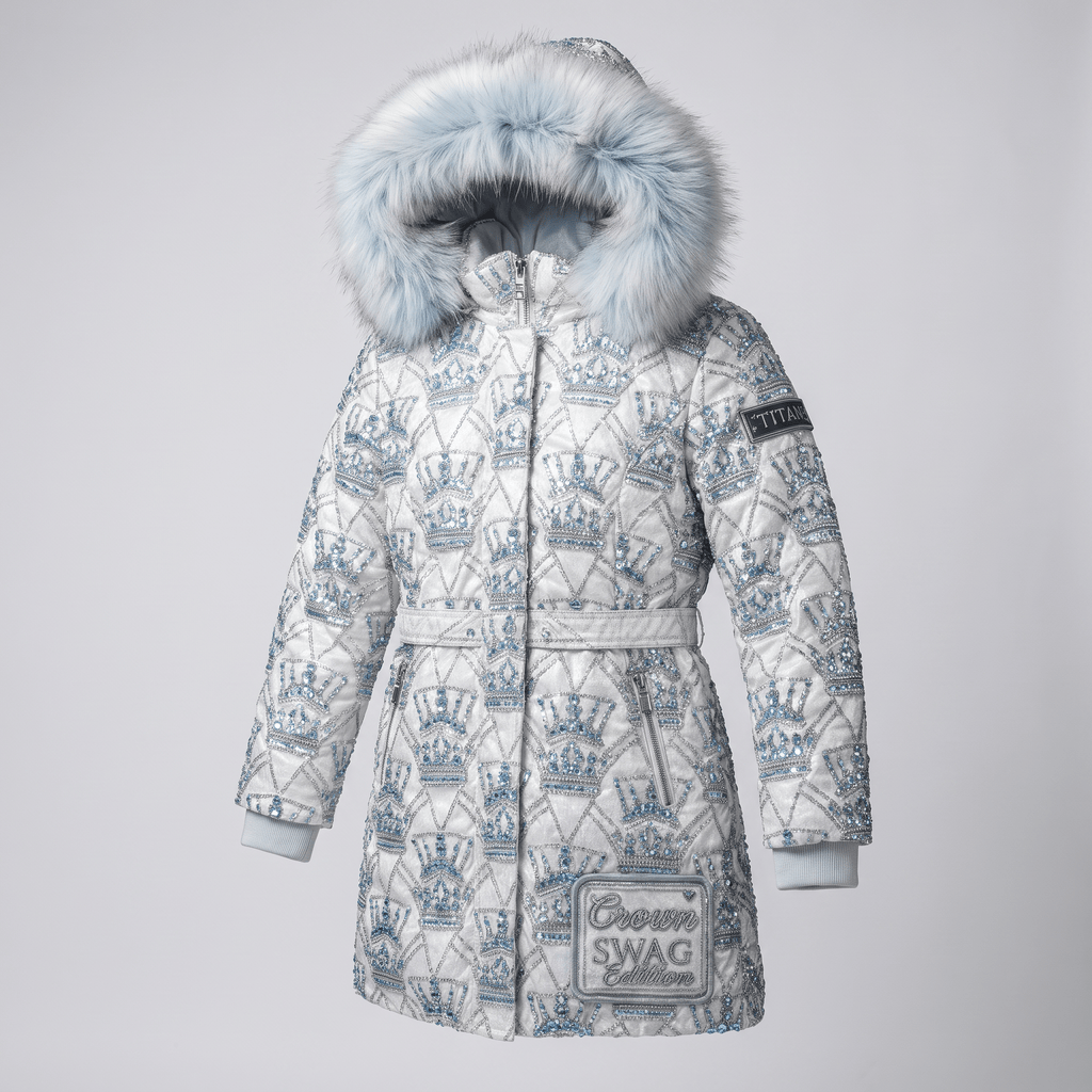 White winter puffer jacket with blue rhinestone crown pattern, faux fur hood, and matching belt.