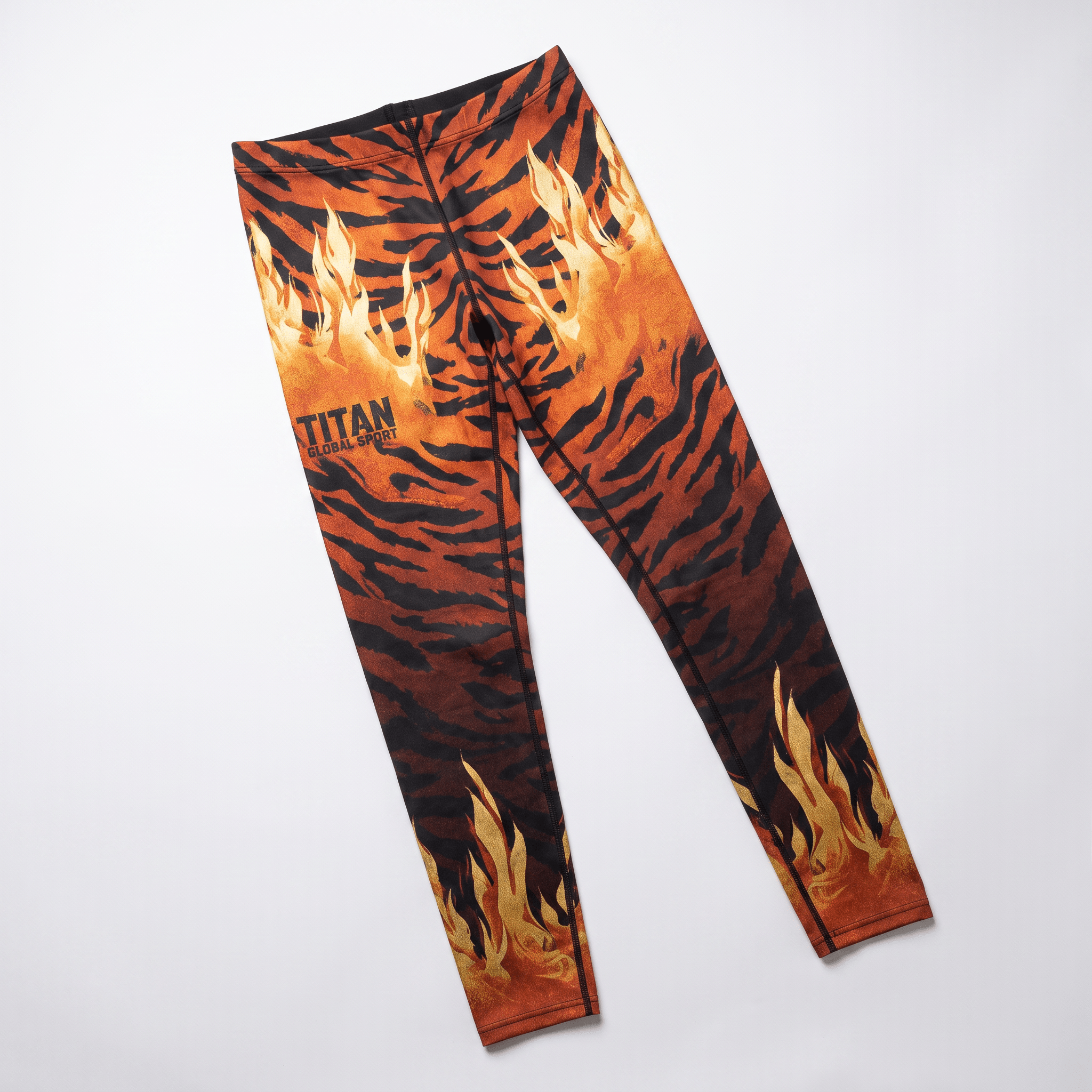Titan Global Sport athletic leggings with orange and black tiger stripe and flame print.