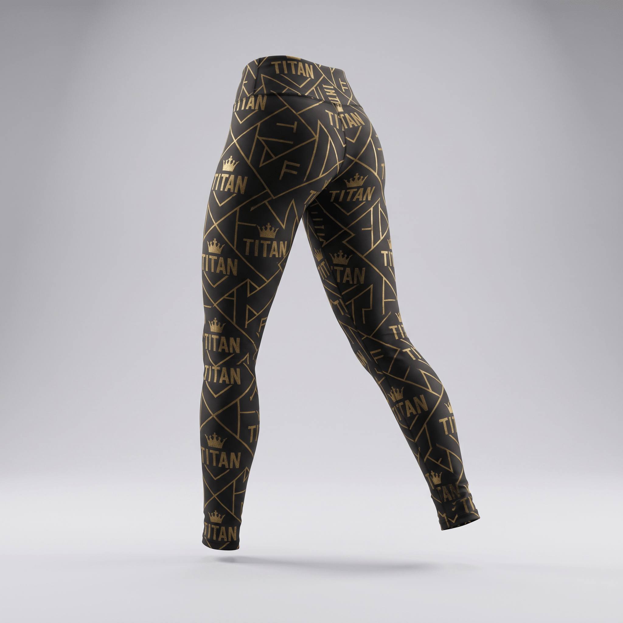 Black and gold Titan print athletic leggings viewed from the back against a gray background.