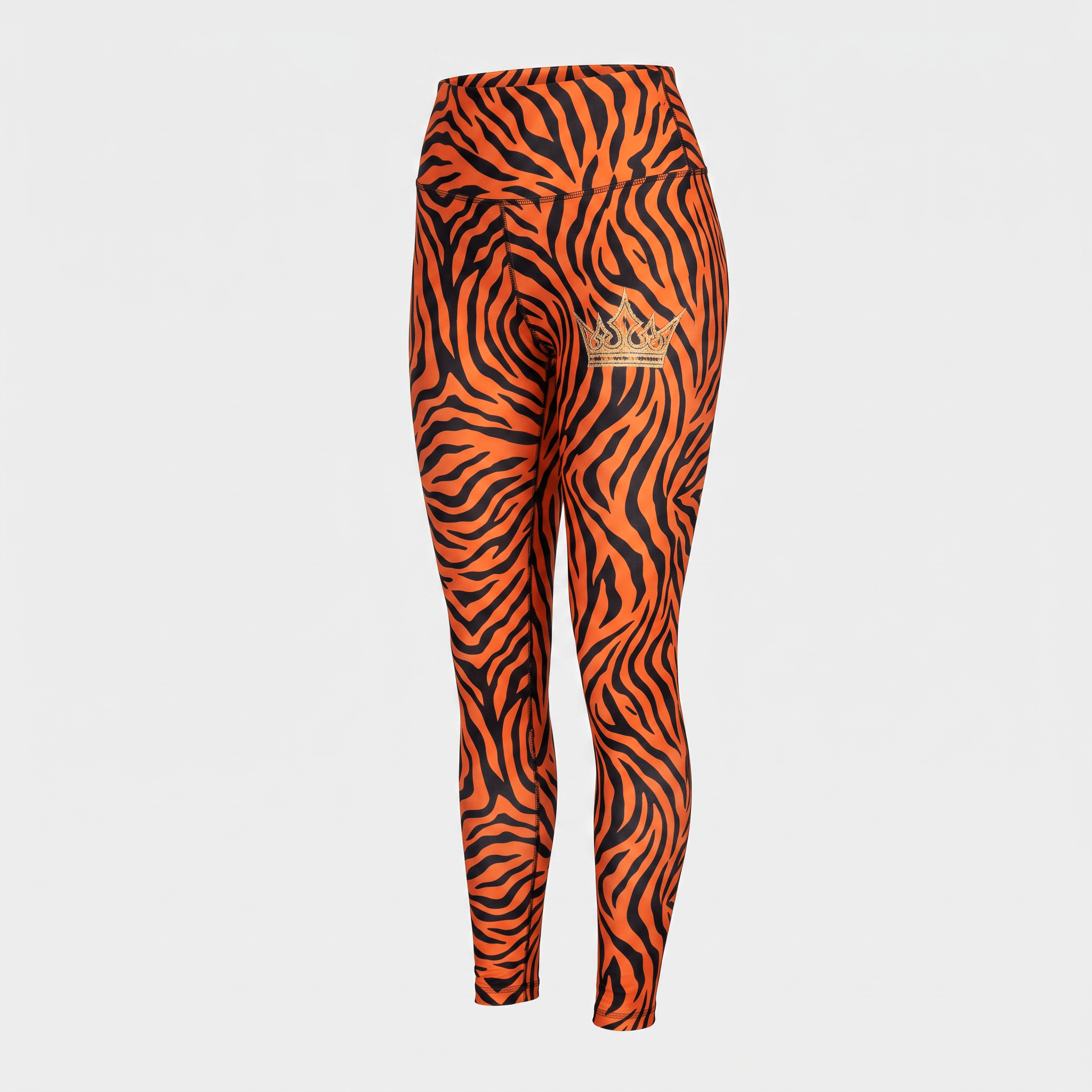 High-waisted orange and black tiger stripe leggings with a gold crown logo on the left hip.