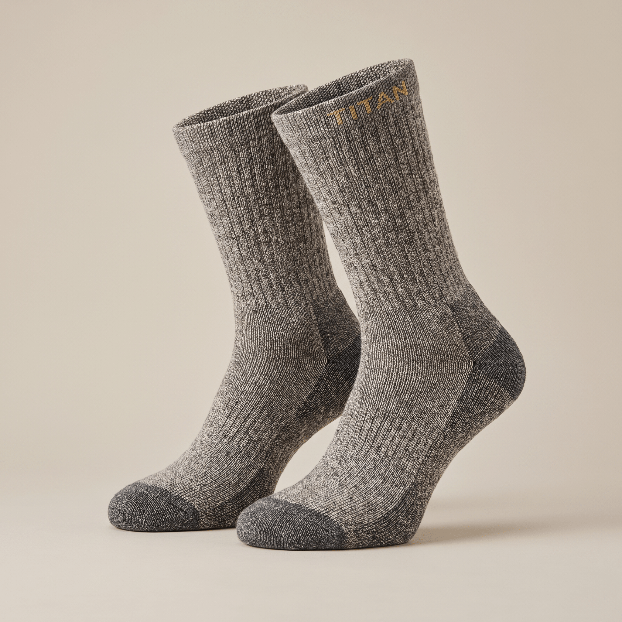 Grey ribbed crew socks with reinforced dark grey toes and gold Titan branding near the top.