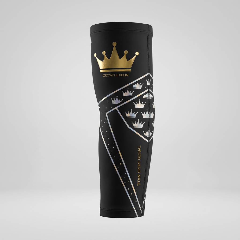 Black compression knee sleeve with gold crown edition logo and reflective geometric pattern.