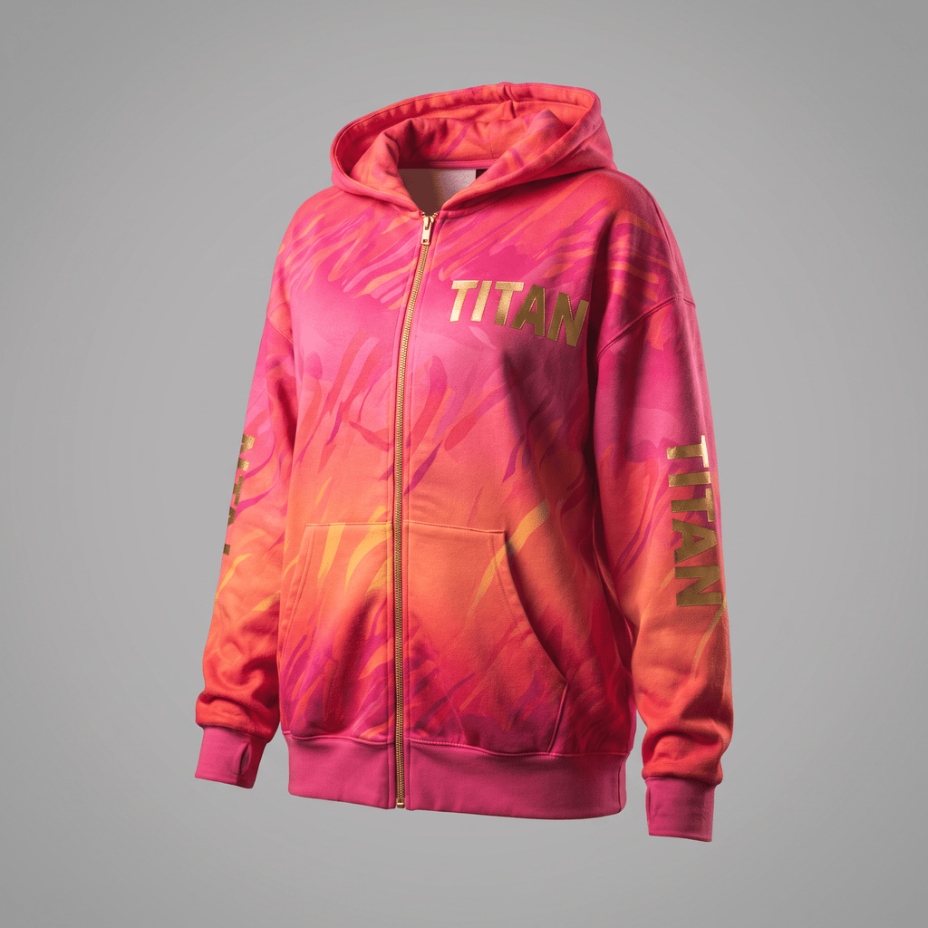 Pink and orange gradient zip-up hoodie with gold Titan branding on chest and sleeve.