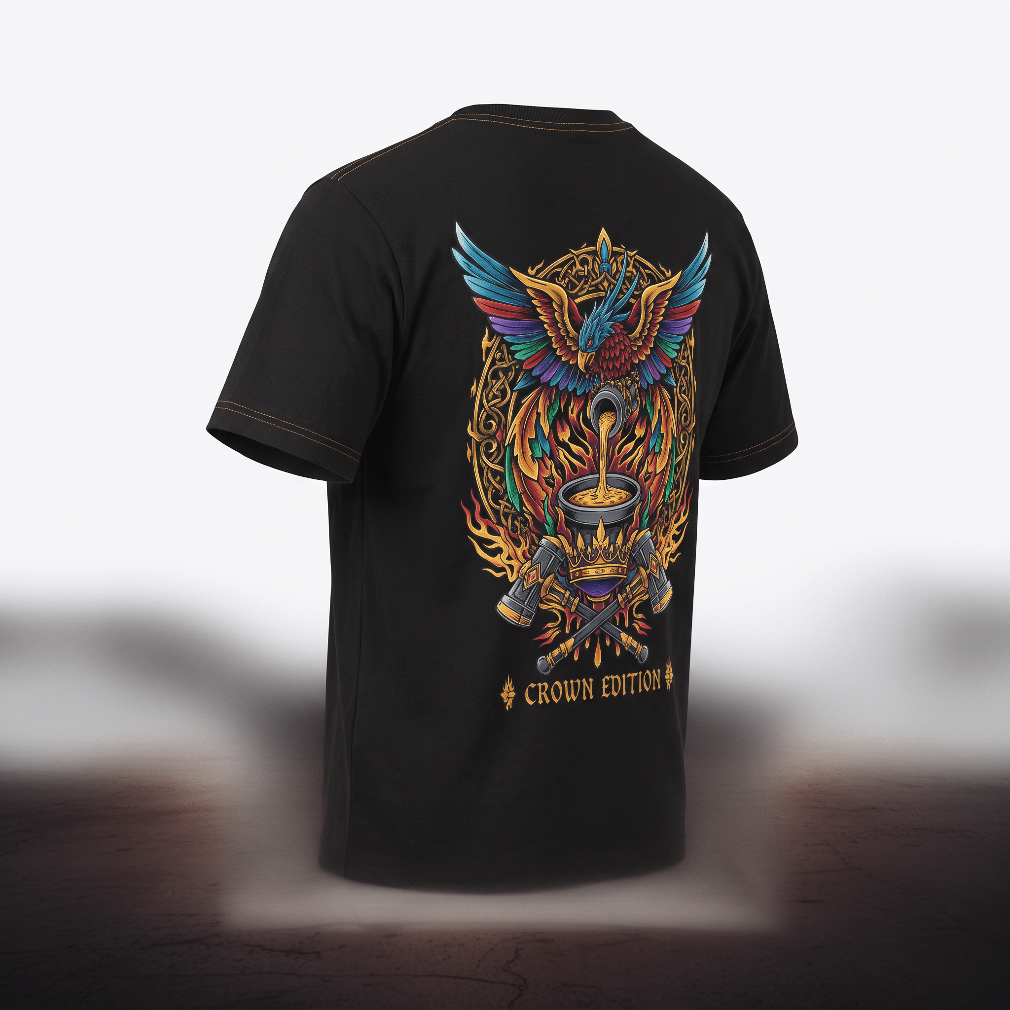 Black t-shirt featuring a colorful back graphic of a mythical bird, crown edition text, and crossed hammers.