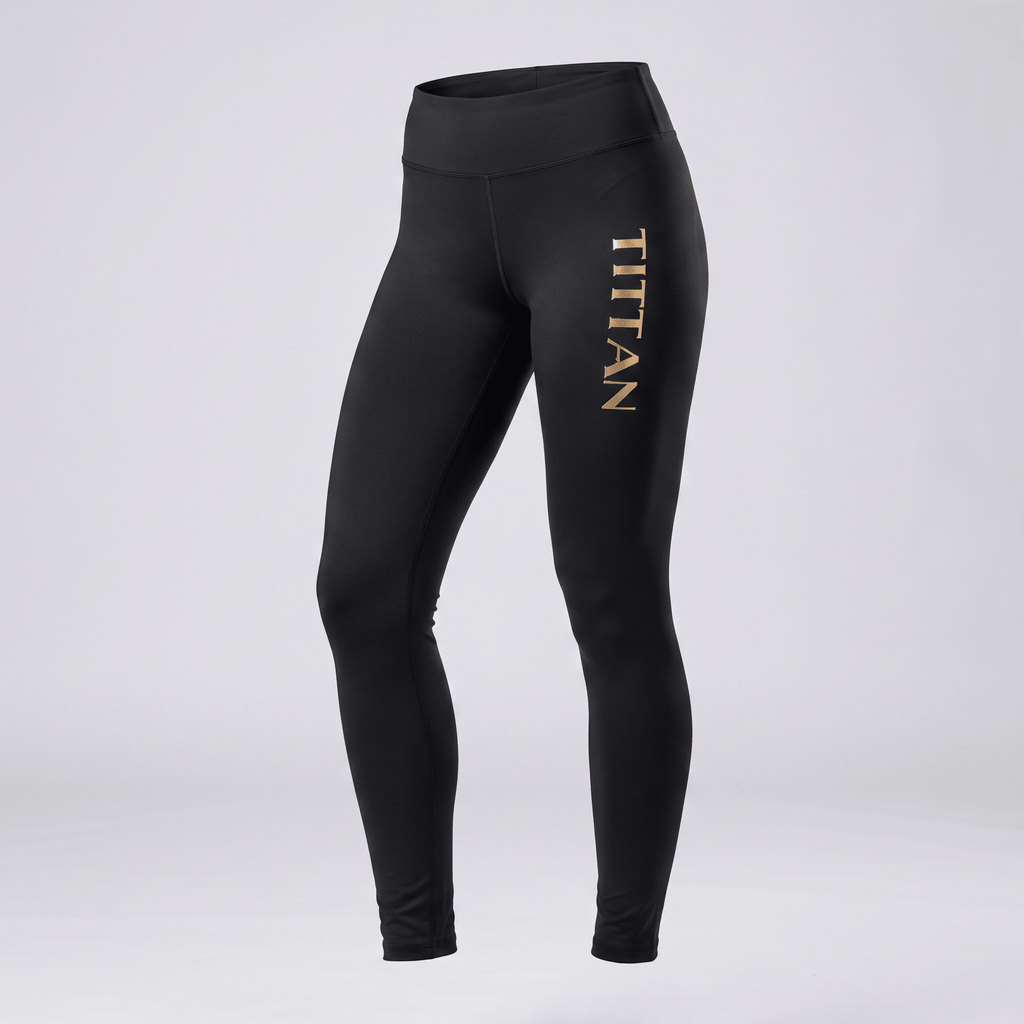 Black athletic leggings with high waist and gold TITTAN text on the left leg, viewed from the front.